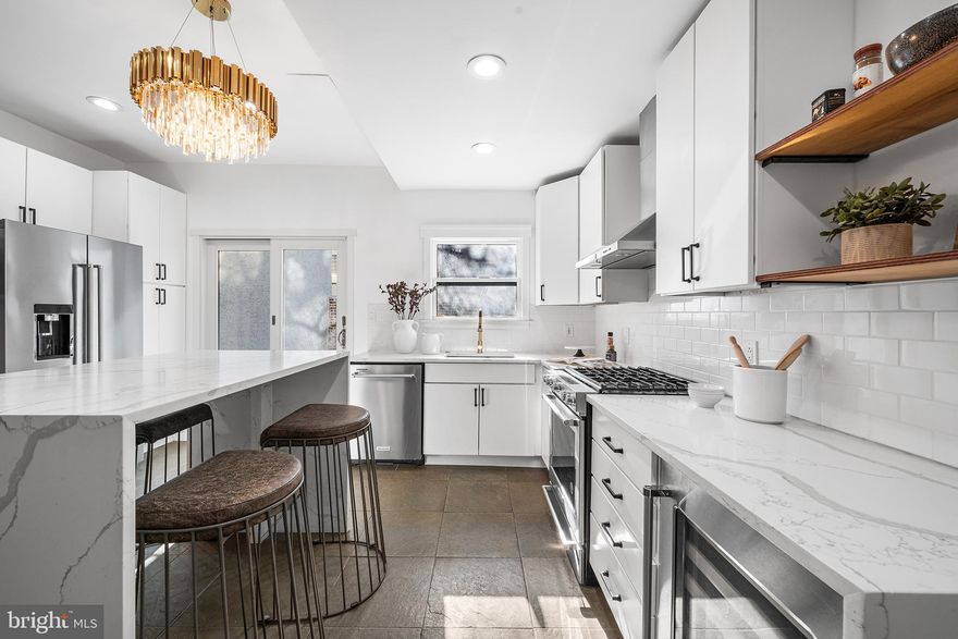 Live in a walker's Paradise, just steps from Rittenhouse Square Park, surrounded by many of the city's best restaurants, shopping, and conveniences, 1932 Pine St. is the ideal address for those wanting to be within arm's reach of all that the city offers!

Enter from the beautiful tree-lined Pine Street into the huge living space, with high ceilings, that's made for entertaining and comfort. A fully-renovated, modern kitchen connects the living space to a stone patio on the rear of the property, complimented by gorgeous foliage in a natural and private setting. 

Original wood floors pair character with the endless updates and modernization brought about by a recent renovation throughout. On the second floor, a primary suite is complete with ensuite bathroom and second floor sundeck. Down the hall, find another spa-like bathroom with rainfall shower, dual vanities, and great natural light. The third floor is home to two additional bedrooms, each spacious and bright. The lower level, accessed from the kitchen, has great storage space, as well as laundry and a powder room. NEW third floor ROOF being installed May 2026.

Rittenhouse Square is the premier Center City neighborhood and it is loaded with some of the best restaurants, cafes, and shopping that the city has to offer. There are several monthly parking options within the surrounding blocks and ample options for public transportation as well. Fitness and wellness options are nearly unlimited in the neighborhood, as are dining options. The walk score for this property is 98, and it also ranks at the highest levels for public transportation (100) and biking (98).