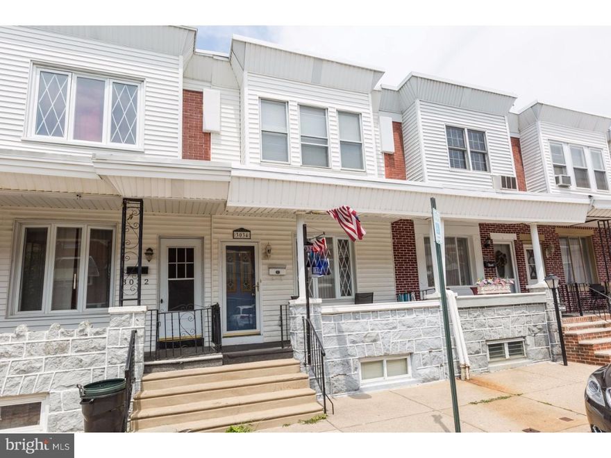 We have an absolutely charming 3 bedroom porch front home with deck and finished basement located in the highly desired Port Richmond neighborhood. One of this home's most outstanding features is it's abundant windows and ample living space. Enter in from the covered porch through a full glass storm door. The living room is the size of most living room and dining rooms together but this home even has a formal dining space. There is a really beautiful custom light house window in the living room and in the Dining room there is fun glass slider doors leading to the rear deck area. The kitchen has a breakfast bar, double wide pantry, refrigerator, microwave and gas range. The living room stair rails are made of decorative contemporary wrought iron leading to the full finished basement. This room is beautiful and can serve your every need as a media room, man cave, spare 4th bedroom , etc. There is a custom built in bar are and laundry room. The 2nd floor has 3 spacious bedrooms. The master includes a double wide his and hers closet, and 3 huge windows. The full bath is completely tiled with a storage vanity and bath/shower combo. All of the doors are natural stained wood, radiator heat and central air, and multiple ceiling fans. We think you will adore this home!