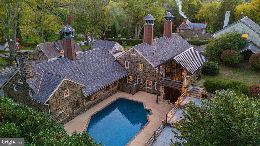 Discover a historic gem in the coveted Radnor Hunt neighborhood.  A family compound property, formerly Echo Valley Farm which is part of the prestigious William Lewis Farmstead. This unique property has graced the Episcopal Academy House Tour, showcasing the best of the Main Line. This enchanting property sits on 1.83 picturesque acres.

Housed in the original Granary, the gated entrance to the main residence features a sun drenched garden patio, gourmet kitchen with secondary butler’s kitchen, luxury stainless appliances, refinished soapstone counters, fresh paint and original hardwood floors, leading to a captivating living room with exposed beams. The first floor master suite features vaulted ceilings and a marble bathroom with a jacuzzi tub. The second and third levels are a blank slate for the new owner to customize their perfect floorplan with a natural stone wood burning fireplace, large windows, a full bathroom and space for 2-3 bedrooms. 

The renovated barn has been converted into a majestic English style pub and gaming area. Above the barn there is a huge storage space with full bathroom, potential to renovate this space to create an artist-style loft.

Walk across the wood bridge to the secluded, refinished resort style pool with built-in kitchen and outdoor shower. The pool deck sits on an elevated flagstone patio wrapped by gorgeous natural stone walls - perfect for hosting events and family gatherings.

The property also includes a large office space adjacent to the barn with  guest house or in-law suite above. 
 The guest house offers a versatile living space with a full kitchenette, living room and bedroom.  There are also two lovely updated one bedroom guest cottages. Additional features include new HVAC, newer roof, natural gas for cooking and heating and public sewer. The total square footage of all dwellings is between 11,000 - 14,000 sqft.

The property seamlessly combines old-world charm with modern amenities just minutes from Episcopal Academy, White Manor country club and Downtown Wayne. Experience the essence of horse country along the prestigious Main Line. Your luxury lifestyle awaits – schedule your private viewing today!