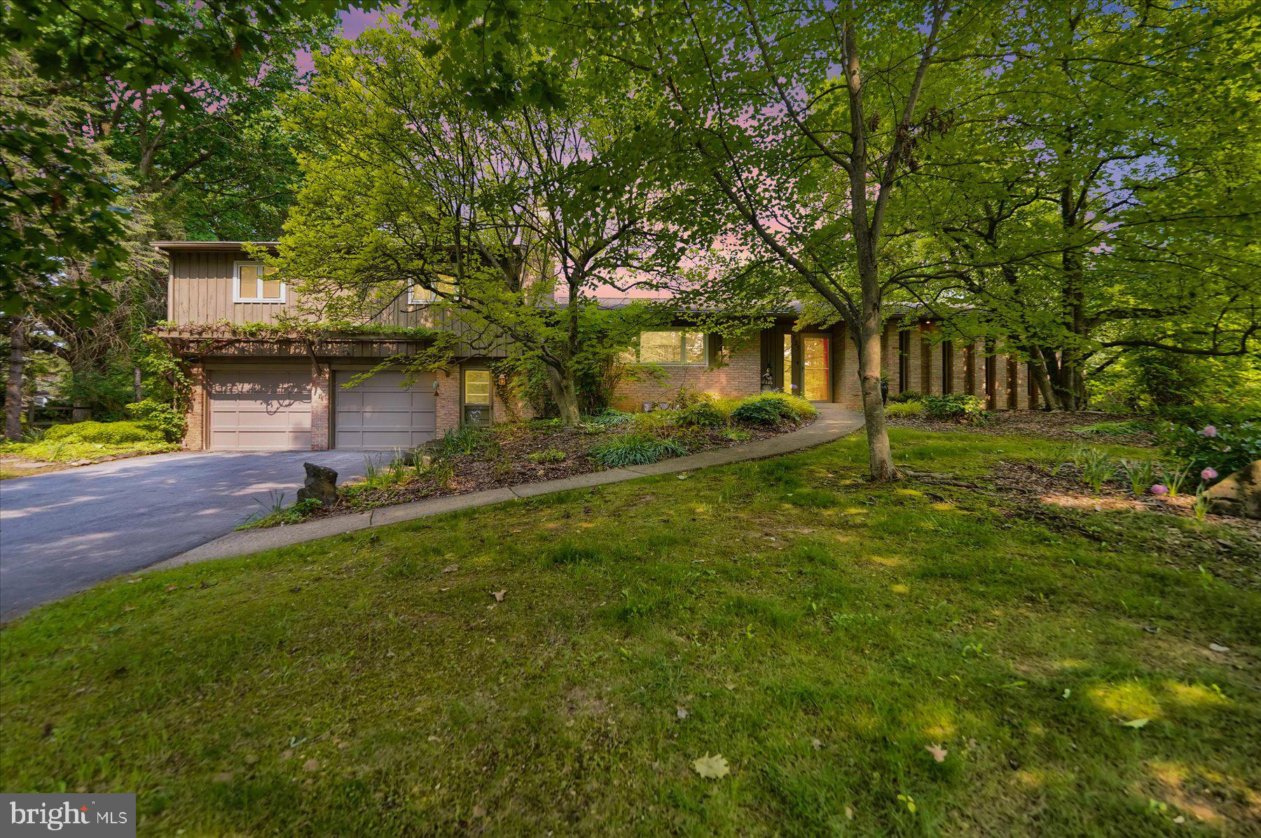 Discover the charm of this stunning mid-century modern home, nestled in the highly sought-after Vallamont neighborhood of State College. Set on an expansive 0.6-acre lot along a quiet street, this home is surrounded by some of the area’s most interesting and unique houses. Enjoy the convenience of a short walk to downtown State College, Penn State University, and the scenic walking trails of Walnut Springs, plus the open spaces of Lederer Park.
The primary level boasts elegant hardwood and tile flooring throughout, featuring a spacious sitting room, a welcoming living room, an expansive owner’s suite with a beautifully updated bathroom, a modernized kitchen, a dining room, and a bright, sunlit sunroom equipped with a mini-split heating and cooling system. Upstairs, you’ll find three additional bedrooms, a full bathroom, and ample storage or playroom space.
This home includes a generous two-car garage and a large unfinished basement, offering potential for even more living space. Outdoors, relax on the charming hardscape patio, surrounded by a fenced yard adorned with vibrant flowers and gardens.
Don’t miss your opportunity to own this unique and exceptional home!
