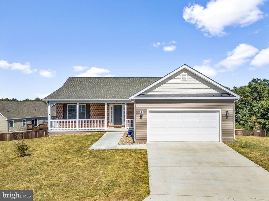 Tucked at the end of a cul-de-sac in Martinsburg’s Heritage Hills, this 5-bedroom, 3-bath ranch delivers almost 3000 square feet of finished living space on one of the community’s largest lots. Built in 2020, it offers the ease of main-level living with the flexibility of a fully finished lower level.

Step inside to soaring cathedral ceilings and a bright, open layout. The kitchen blends style and function with granite counters, a double sink, and an adjoining dining space that flows to a 20x12 deck—perfect for catching fall colors, distant fireworks, or even the Air Guard in action. The spacious primary suite features a walk-in closet and private bath with a walk-in shower, while two additional bedrooms and a full hall bath are tucked away on the opposite side of the home. A convenient laundry room connects to the oversized 2-car garage.

Downstairs, the walk-out lower level offers two bedrooms, a full bath, and an expansive open living area—ideal for guests, teens, or in-laws who want their own space. 

A covered front porch, wide 32”+ doorways for accessibility, fenced backyard, lofted storage shed, vinyl-clad windows, and a high-capacity water heater add comfort and convenience. Surrounded by trees and the sound of Cold Run Springs after a rain, this property balances privacy with proximity to all that Martinsburg offers.