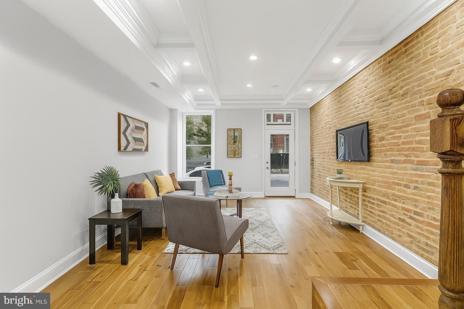 Discover modern luxury at the buzzing center of Charm City with this fully renovated townhome in Upper Fells Point—one of Baltimore’s most vibrant and walkable neighborhoods. This 3-bedroom, 3.5-bath home features gleaming hardwood floors on all levels, a sleek modern paint scheme, and a stunning gourmet kitchen with stainless steel appliances, quartz countertops, and custom cabinetry. Enjoy spa-inspired bathrooms, spacious bedrooms, and an ideal rooftop deck with a bar sink perfect for entertaining or unwinding with city views. The open-concept layout balances comfort and sophistication, making this home ideal for both daily living and hosting guests. Nestled on a quiet, historic street, you’ll love being just blocks from Fells Point’s lively waterfront, local coffee shops, boutique shopping, renowned seafood spots, and vibrant nightlife. Patterson Park, one of the city's best green spaces, is only a short walk away. Commuters will appreciate easy access to I-83, I-95, and I-895, plus nearby MTA bus stops, the Charm City Circulator, and the Shot Tower Metro Station. BWI Airport is reachable in under 30 minutes. Whether you're heading to Johns Hopkins, the downtown Baltimore Inner Harbor, or Washington DC within 45 minutes, you're well-connected. Upper Fells Point is known for its strong community vibe, historic charm, and cultural flair, frequently recognized as one of the city's best places to live. Don’t miss this opportunity to live stylishly in a fully updated home that puts you in the middle of everything Baltimore has to offer.