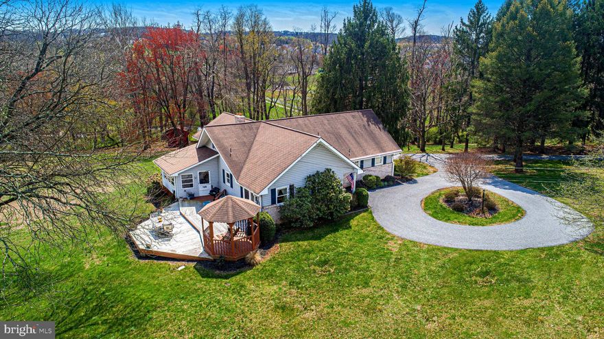 Multiple Offers received - OFFER SUBMISSION No Later Than Monday April 28, 2025 at 2:00PM - Welcome to 1285 Homewood Road, a peaceful retreat on nearly four acres. Tucked away in a private setting with serene nature views, a meandering stream, and a neighboring horse farm, you will appreciate the blend of comfort, charm, and land to roam. The open space, mature trees, and two sheds create endless opportunities for outdoor recreation, hobby farming, or simply soaking in the beauty of nature. With four bedrooms and two full baths, this home is built for easy living with features of warm hardwood floors throughout the main-level bedrooms and a sun-filled family room with a soaring cathedral ceiling and a striking Palladian window framing the natural beauty outside. The eat-in kitchen shines with granite countertops, stainless steel appliances, recessed lighting, ceramic tile, and a breakfast nook. A nearby formal dining area and all-seasons room make this home perfect for entertaining and relaxing. The owner’s suite offers a private bath, while a bonus upper-level bedroom and versatile recreation room give space for guests, hobbies, or future expansion. Step outside to truly appreciate the lifestyle this home offers—an extended deck for outdoor dining, a gazebo for enjoying your morning coffee, and acres of natural beauty to explore, garden, or play. For those who love to tinker or build, the large unfinished basement is a dream come true, with a full workshop area and endless project potential. Add in the oversized three-car garage, and you have storage and space for all your tools, toys, and hobbies. All this peace and privacy—just minutes from I-83 and Route 30. Here is your opportunity to live close to everything while feeling a world away. Schedule your showing today!