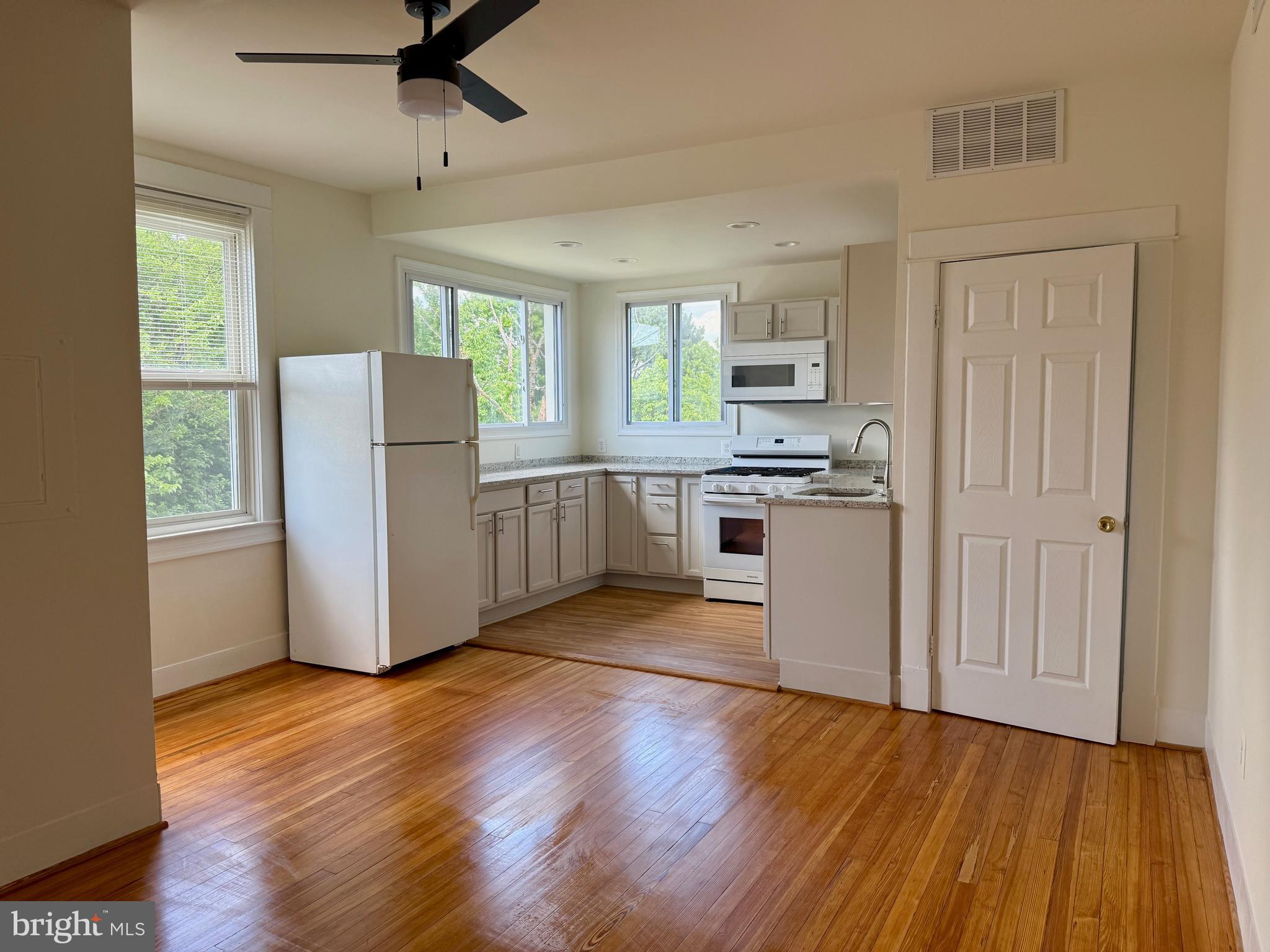 Welcome to this beautifully updated second-floor, two-story apartment located in a detached home in Parkville. The gourmet kitchen boasts new luxury vinyl flooring and granite countertops, ample cabinetry, a new dishwasher, an over-the-range microwave, range, and fridge. The kitchen flows into a spacious dining area with newly refinished hardwood floors. With three bedrooms and two full baths, this unit features a private ensuite with a modern, spa-like bathroom. Hardwood flooring continues through the dining room and the 3 bedrooms. The updated hall bath features a convenient (and new) in-unit laundry. Upstairs, you'll find a full-level family room with brand-new luxury vinyl flooring—perfect for relaxing or entertaining.
Rear parking is available, plentiful, and free! Tenants are responsible for having their own BGE account. Water is billed by the landlord based on the County bill. Sorry, no pets. The unit has its own Forced Air and AC unit, so this is completely separate from the other unit.
Don’t miss this opportunity for comfortable, stylish living in a convenient Parkville location!