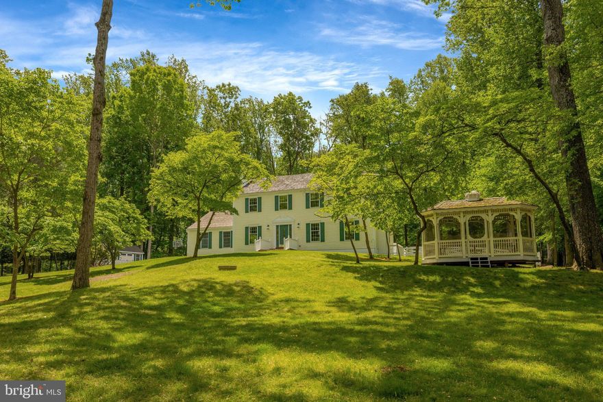 Unwind!  Enjoy Benefits of Being Outdoors!  Inviting Peaceful Cul-De-Sac Setting  Awaits Your Move to this thoughtfully updated home perfectly sited on 2.38 Acres of treed land in the desirable Potomac Forest neighborhood off sought-after River Bend Road location in the heart of Great Falls.  The entire wooded acreage has had attentive tree care creating an exceptional lot for play, entertainment and relaxation with tranquil private views from every corner of the property.   Several dogwood trees in the front yard have been cultivated to provide a burst of Springtime white blossoms.  The turnkey home with 3645 finished sq ft has been updated in 2024 – 2025 highlighted by interior painting on three levels, tastefully updated bathrooms, powder room and kitchen, new light fixtures plus recessed lighting, Two HVAC systems, Water Heater and new carpet in upper level rooms.  You will appreciate splendid wood floors on both the main and lower levels.  The main level living and sitting rooms have wood burning fireplaces.  The light-filled eat-in kitchen has new appliances with a gas cooking and attractive Corian countertops.  The kitchen area has a huge walk-in pantry and access from eat-in section of the kitchen to the deck overlooking the partially fenced yard with acreage extending far beyond the fence.   A powder room and dining room with Dutch doors complete the main level.  The upper level features the primary suite with a spacious walk-in closet, private bath with double sink vanity and a sitting room.  A fourth bedroom on the upper level was converted to the primary sitting room or nursery and offers additional closets.  There are two other bedrooms, two large hall closets plus a very convenient laundry area on the upper level.  The large hall bath on the upper level has a bath + shower plus an extra walk-in shower.  The expansive walk-up lower level has much to offer: a fourth bedroom, office, exercise room, large open recreation room plus a second convenient laundry area with New Washer and Dryer.  A premium perk is the over-sized Three Car Heated Garage!  Two custom made garden sheds have interior upgrades and the custom made screened gazebo with seating are color coordinated with the main residence to enhance the extraordinary land.  A bonus backyard, second driveway offers ample additional parking for dozen or more cars ideal for gatherings.  9201 Potomac Woods Lane is a very special home four minutes and equidistant to Great Falls Elementary School, River Bend Park, Great Falls Village Center featuring shops and restaurants and the Great Falls Post Office.  Tysons Corner & Reston Town Center attractions plus nature’s wonders at Great Falls National Park are just short distances away.  Potomac Woods is in the coveted Langley High School Pyramid.