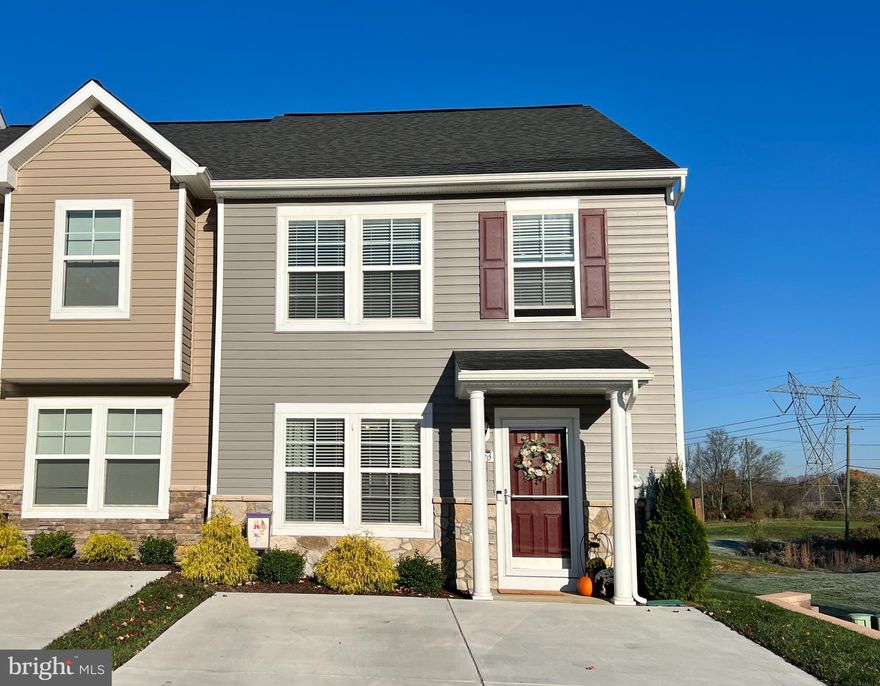 Welcome to 203 Ran Rue Drive, a meticulously maintained end-unit townhouse in the sought-after Archers Rock community of Martinsburg, WV! This almost new, 2-bedroom, 1.5-bathroom home is the perfect fit for first-time homebuyers, downsizers, or buyers with a roommate. Tucked away at the end of a cul-de-sac, this property offers privacy and convenience, with easy access to Winchester, Hagerstown, and major commuter routes.

Step inside to discover a light-filled, open-concept first floor, featuring an impressive 8-foot center island with granite countertops, stone backsplash, and stainless steel appliances, including a 5-burner gas stove. The fully fenced backyard, complete with epoxy-coated patio,  and lush green grass, provides the perfect space for outdoor enjoyment and entertaining.

Upstairs, two spacious 17x12 bedrooms await, with the second bedroom offering ample space for both a home office and bedroom furniture. The laundry is conveniently located on the bedroom level, and upgraded luxury Hearthside Hickory vinyl plank flooring with soft-sound underlayment can be found throughout the first level, second bedroom, and bathroom. 

Additional features include Levolor blinds on all windows, carpet in the hallway and primary bedroom only, and an HOA fee that covers snow and trash removal. Just minutes away from shopping, dining, I-81, and the hospital, this move-in ready townhouse offers unbeatable value for today's discerning buyer. WASHER & DRYER, AND A BRAND NEW SNOW BLOWER CONVEY! ONE YEAR HOME WARRANTY INCLUDED & ONE YEAR HOMEOWNER'S ASSOCIATION DUES PAID ON BEHALF OF BUYER.  Don't miss this amazing opportunity – schedule your showing today!