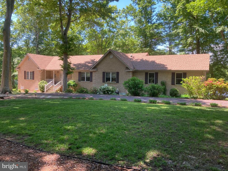 Take advantage of this rare opportunity to own a fantastic, custom home boasting 421 feet of water frontage on Lake Independence and full access to the Potomac. One of the clearest lakes in VA fed by 7 natural springs. 308 Bishop Drive offers privacy as well as all of the wonderful amenities of Stratford Harbour, including Lake Beach, Lake Marina, Potomac River Marina, Shark Tooth Beach as well as a clubhouse with pool, clubhouse tennis and so much more! The home's original design and excellent build quality have been enhanced by the current seller's various updates and consistent maintenance through the years. Exquisite hardwood flooring and crown molding throughout the home. Granite countertops in the kitchen boasts a gorgeous tile mural in the backsplash of the kitchen. You will love the glass lighted cabinets and large pantry for even the pickiest chefs! The focus remaining on the outdoors with expansive glass and views from all rooms is evident through the open plan design. The large kitchen, dining room, living room, and sunroom flow seamlessly together for living and entertaining ease. The lower level is designed to offer an in-law/guest suite with a huge great room and separate bedroom (not to code), as well as a kitchenette area. The fully insulate oversized 25' x 22' garage has room for toys and cars. The multiple decks and lower patio with outdoor shower, face across the lake, presenting breathtaking views. For your ultimate privacy, no other homes are visible as you gaze across the lake. The serenity and the wonders of nature, eagles, falcons, egrets, and ducks abound through all the seasons, evoking the feeling of your own personal retreat. The scenic lake views and the opportunity to enjoy the Potomac River and the beaches with access for sailing, fishing, and boating with only 12 miles by boat from the main Chesapeake Bay make this one "the one!" You can truly enjoy it all including Hi-Speed Internet! Two new hot water tanks in 2022, a new roof in 2017, a heat pump in 2012, and regular septic service on a 3-year basis all make this a turnkey home to enjoy immediately. This is one not to miss!!