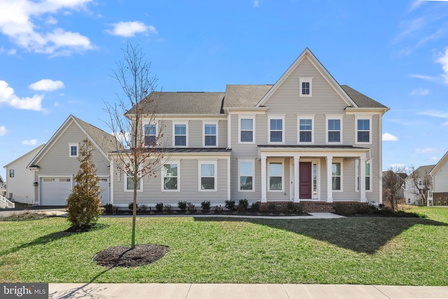 PLEASE NOTE:  SELLER WORKS FROM HOME AND WILL BE IN THE UPPER SECONDARY BEDROOM DURING SHOWINGS.

Welcome to this stunning single-family home located in the highly sought-after community of Hartland! Set on a nearly 1/2 acre premium lot, this home boasts a 10-zone irrigation system, ensuring a lush and well-maintained exterior. The large brick-front porch invites you into a beautifully designed open-concept floor plan, complete with upgraded luxury vinyl plank flooring and exceptional finishes throughout.
The main level features a spacious library with custom built-in shelving, a separate dining room, and a large gourmet kitchen, perfect for cooking and entertaining. The kitchen is equipped with an expansive center island, quartz countertops, stainless steel appliances, walk-in pantry and an adjacent breakfast area that overlooks the generously-sized family room. Enjoy easy access from the kitchen/family room to the stunning covered porch, ideal for outdoor entertaining or relaxing with your morning or afternoon tea.
A highlight of this home is the in-law suite on the main level, which includes its own private entrance, laundry room, full bathroom, and a two-car garage. Additionally, the home offers a second 2-car garage for a total of four garage spaces, complete with an electric vehicle charger.
Upstairs, you'll find 4 spacious bedrooms, 3 full bathrooms, and a separate laundry room for convenience. The large primary suite features a tray ceiling, dual walk-in closets, and a luxurious en-suite bathroom with dual vanities, a soaking tub, and a separate two-headed seamless glass shower. The 3 secondary bedrooms are all outfitted with luxury vinyl plank flooring.
The lower level of the home is an entertainer's dream, with a large recreation room, a 6th bedroom, a 5th full bathroom, and a rough-in for a future wet bar. There’s plenty of storage space, and a walk-out leads to the large backyard, which backs to a tranquil common area.
Additional features of this home include solar panel readiness, hot tub readiness, and cable/ethernet ports in every room, providing modern convenience throughout. Enjoy the many great amenities this community offers, such as community pool, tennis & basketball courts, walking/jogging/biking trails, and a gym. Conveniently located close to major commuter routes, shopping and restaurants!
This home is a true gem and offers a perfect balance of luxury and functionality in this idyllic community—don't miss the opportunity to make it yours!