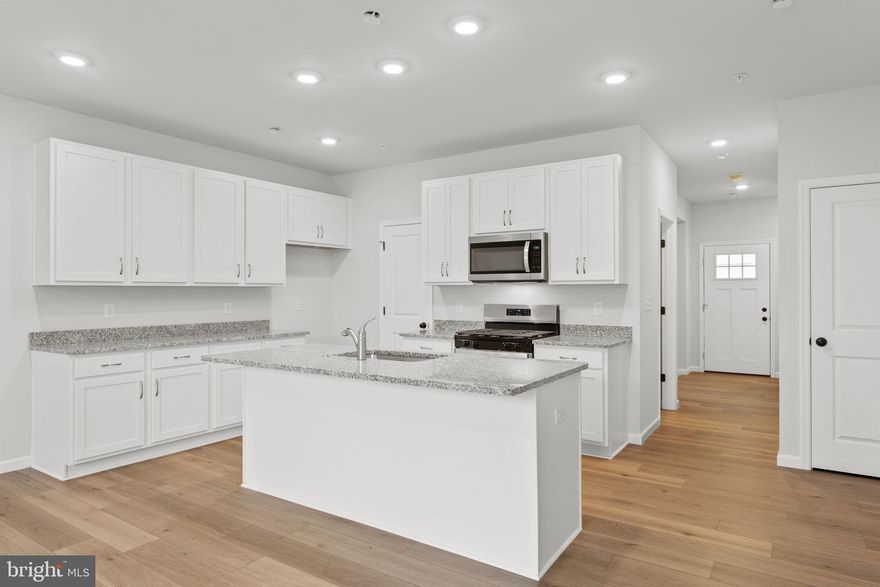 This move-in ready townhome is located in the heart of Perkasie, The Winchester I is a beautifully designed three-story townhome, with a detached one car garage. Enter the home through a welcoming covered front porch and be greeted by an ideal open-concept living space.  Perfect for entertaining friends and family, this spacious kitchen includes granite countertops and a large center island overlooking the great room and dining area.  A deck is conveniently located off the great room.  Enjoy the flexibility of gatherings that transition outdoors with ease.  A flex room is also located on the first floor: your dream may be a home office or a designated play area. Elegant oak-tread stairs will guide you to the second floor where you will find two generously sized bedrooms with walk-in closets, a full bathroom and a laundry closet.  Continue to the third floor to your own private retreat!  The spacious Owner's Suite includes a full bath with a large tile shower, cultured marble topped vanity and a sizeable walk-in closet.  The garage is equipped with a 100-amp subpanel, providing convenient readiness for an electric car charger.

Settle in as little as 30 days.