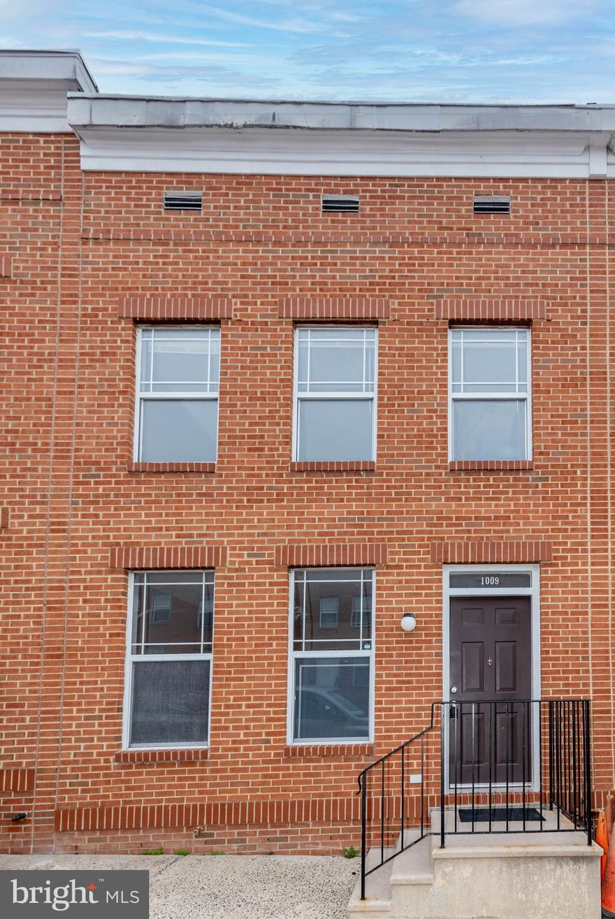 Online Auction Only! List Price is opening bid. Bidding begins Thursday, April 9, 2026 & ends Tuesday, April 14, 2026 at 11:30 AM.  An excellent opportunity to acquire an updated brick townhouse in the Johnston Square neighborhood of Baltimore. This vacant property offers strong potential for rental income or owner-occupancy. Constructed in 1994, the home features a well-designed layout with wood type flooring throughout the main and upper levels. The main level offers a spacious living room, separate dining area, and a functional kitchen, providing a comfortable flow for everyday living and entertaining. The counter top extends to accommodate a couple of counter stools in the kitchen.  The upper level includes three bedrooms, all with wood type flooring. The bath is thoughtfully divided into two sections—one with a sink and shower, and the other with a sink and toilet—connected by an interior door, while also offering separate hallway access to each section for added convenience. The lower level consists of a full, unfinished basement, presenting additional storage or future finishing potential. Systems include a gas water heater, forced hot air heating, sump pump, and electric panel. A dedicated laundry area with hook-ups is also provided. Additional highlights include a fenced rear yard, A/C unit and utility sink in the lower level.  Ideally located in East Baltimore, the property is in close proximity to Johns Hopkins Hospital and the Mount Vernon and Mid-Town Belvedere neighborhoods. Enjoy convenient access to dining, shopping, schools, parks, and major commuter routes, including the Jones Falls Expressway.