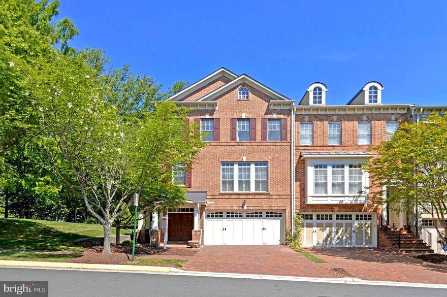 Welcome to 6878 Frase Dr, Falls Church, VA 22043 — the former builder’s model home by Camberley Homes in the highly sought-after Stockwell Manor community. This elegant all-brick, three-level end-unit townhome offers over 3100 SQFT of thoughtfully designed living space, making it one of the largest homes in the neighborhood. Ideally positioned facing a private park with no homes on three sides, the property offers exceptional privacy, abundant natural light, and serene wooded views through high-quality Pella windows. A dramatic two-story foyer opens to a bright, open-concept main level with 10-foot ceilings, rich hardwood flooring, and spacious living and dining areas designed for both everyday living and entertaining. The gourmet kitchen features updated appliances and opens to a deck through a patio door, providing easy access for everyday outdoor use. Upstairs, the primary suite offers a tray ceiling, walk-in closet with custom organizers, and a spa-inspired ensuite bath, along with access to a private balcony. Two additional bedrooms share a full hall bath, with a conveniently located laundry room.The walk-out lower level includes a spacious recreation room with wet bar, built-in cabinetry, gas fireplace, sound system, and a full bath, with direct access to a beautifully landscaped patio and fully fenced backyard. With both a main-level deck and a private upper-level balcony, the home offers multiple outdoor living spaces. Additional highlights include custom built-ins and multi-zone sound system. Recent updates: water heater (2019), washer and dryer (2024) and dishwasher (2024). Premier location just minutes to West Falls Church Metro, Tysons, major commuter routes (I-66, I-495, GW Parkway), shopping, and dining. HOA covers lawn maintenance for a low-maintenance lifestyle. Top rated Haycock ES, Longfellow MS, and McLean HS pyramid