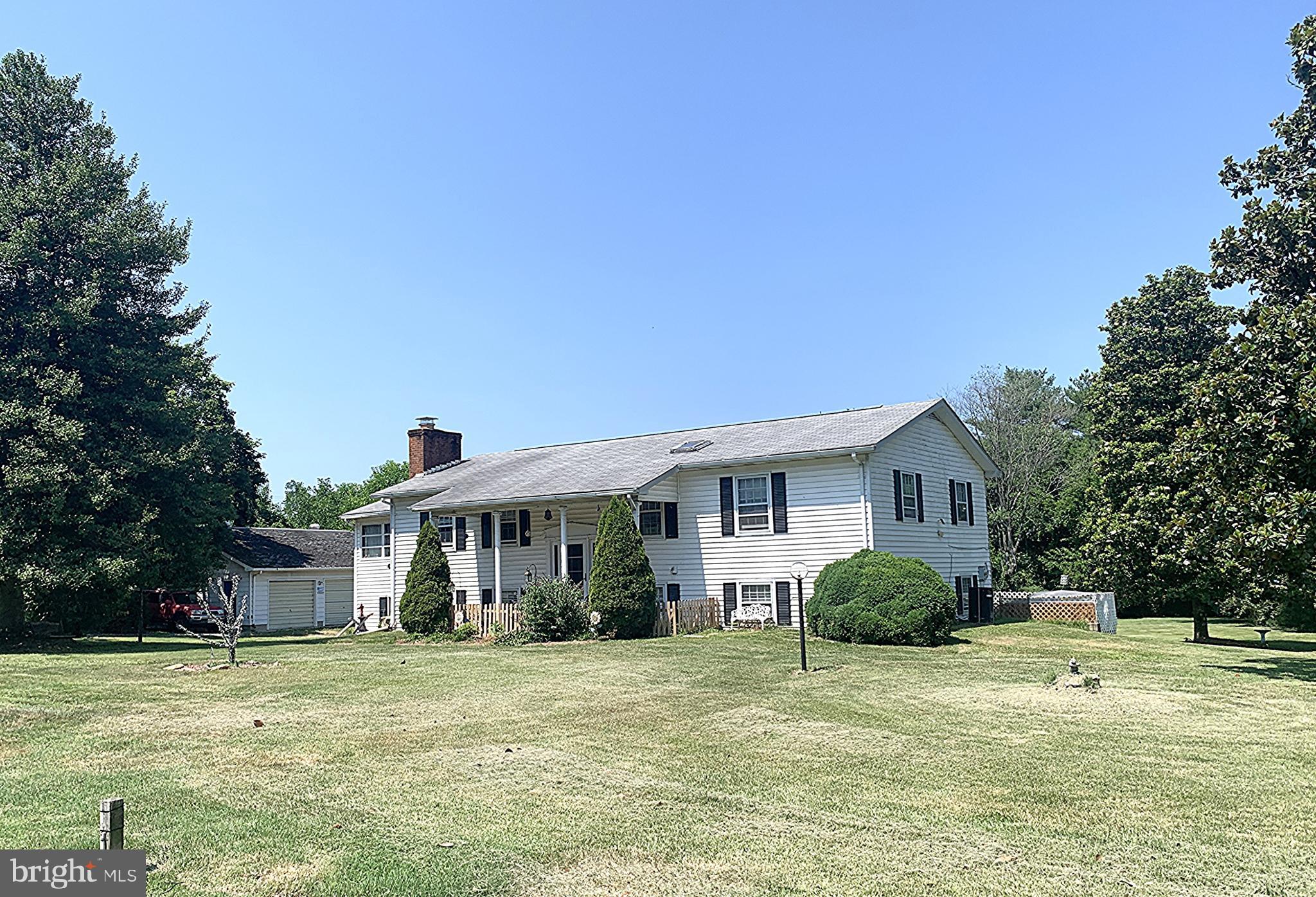 Located in the small Eastern Shore town of Fairlee, this spacious Bi-level sits on 1.65 acres of cleared land, just a short 10-minute drive to both Chestertown and Rock Hall. The home offers 3 bedrooms and 2 bathrooms, with a finished lower level for additional living space. A large sunroom with cathedral ceilings and walls of windows is the heart of the home, filling the space with natural light. Enjoy cooking in the updated kitchen with stainless steel appliances and serving meals in the separate dining room.
Outdoor living is a highlight with an enclosed back porch, decks on both the first and second floors, and plenty of open yard space. Additional features include two fireplaces, a dedicated laundry room, and a shed for storage. A detached 3-bay garage provides ample room for vehicles, hobbies, or workshop space. This property combines comfortable living with generous space inside and out, all in a convenient location close to towns and the water.