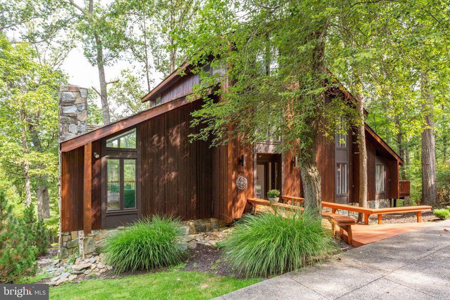 Architect designed one-of-a-kind contemporary on one of the most beautiful estate sites in McLean. Fabulous views from every window. Quality built of stone and cedar by original builder/owner. Cathedral ceiling in LR, MBR and 31x15 loft. Lots of glass, multiple decks and patios. Four fireplaces. Bonus: 2.3 acre lot with 1 acre zoning. Ten minutes to Wolf Trap, Silver Line, and Tysons Corner.