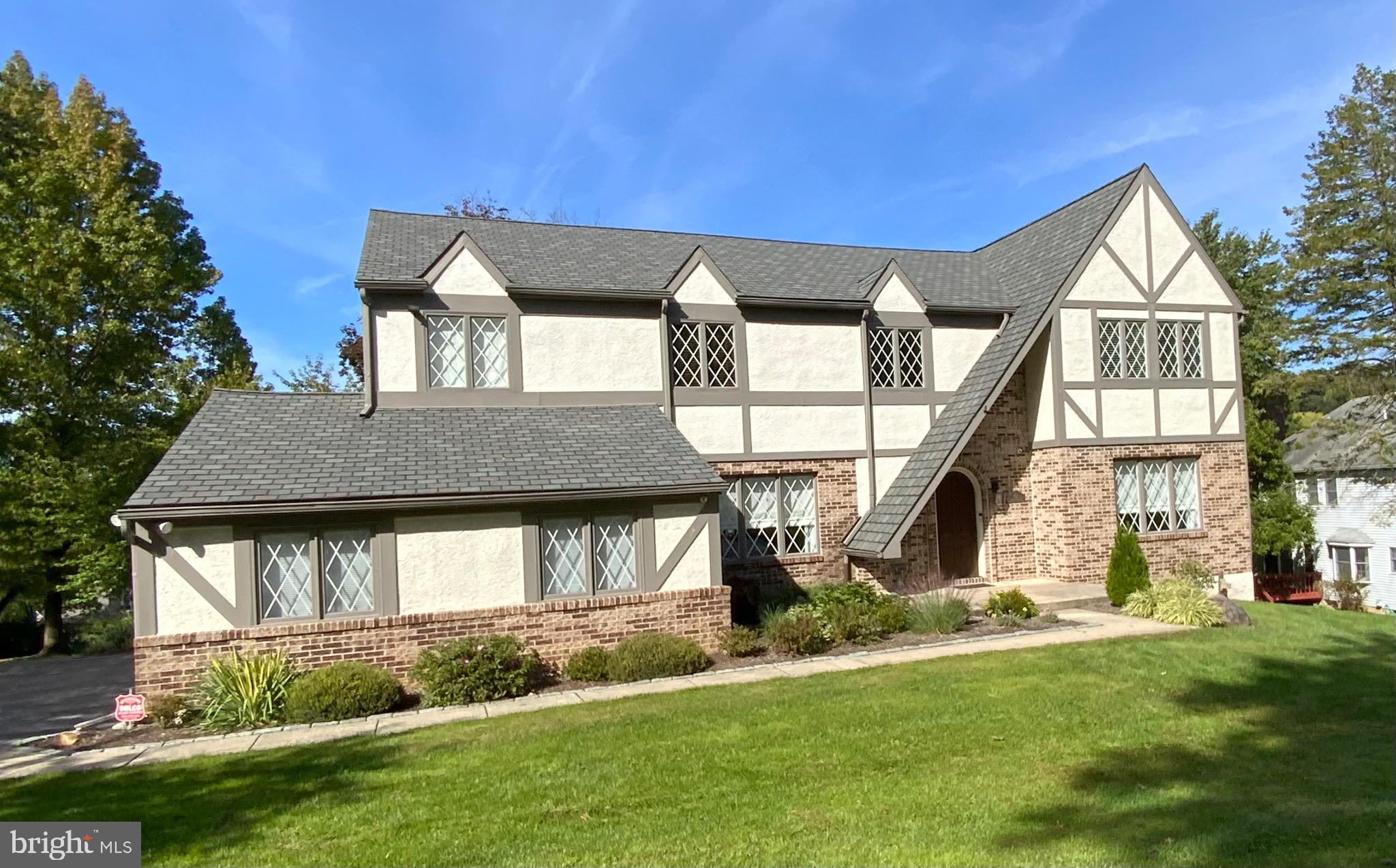This gorgeous Radnor Chase Tudor home is move-in ready and has been tastefully updated and wonderfully maintained. This 5 Bedroom 3.5 Bath home offers generous space inside and out and is located in the award-winning Radnor School District, including Ithan Elementary. The center hall Tudor has been renovated throughout with great thought and attention to detail. Enter through the Two-Story Foyer. The Formal Living Room is bright and spacious with chair rail, crown molding, and French doors opening to the Great Room. The Formal Dining room with crown molding opens to the Kitchen. The Gourmet Eat-In Kitchen with Center Island has Stainless Appliances, Under Mount Lighting, Tile Backsplash, Farmhouse sink, Gas Range with Custom Hood. The kitchen/living area continues with a sunny and bright adjoining breakfast room complimented by two large casement windows with outdoor deck access and space for a large table opening to the Great Room with a brick gas fire place, giving you the open layout for everyday living or entertaining. Through the hallway is a convenient first floor Powder Room. There is a bright Mud Room, full Laundry with an outdoor exit to the Deck, yard, and 3 car attached garage. Upstairs to the second floor is the expansive primary suite with 2 walk-in-closets and a large en suite bath. There is a Balcony that looks out into the lush back yard. There are three other generous sized bedrooms and full bath on the second floor, a Loft off the third Bedroom, and a Walk-Up Attic. There is a finished walk out basement which includes a 5th bedroom with an en suite bath. The main finished basement space can be used for a media room, game room; the possibilities are endless. There is an additional-home gym room. Outside Exit to covered patio. Radnor Chase is an incredible community with a perimeter trail, mature trees, beautiful streets and architecture and a superb location that is only a short drive to downtown Bryn Mawr with train access to Center City, boutique shopping and a wide selection of restaurants.