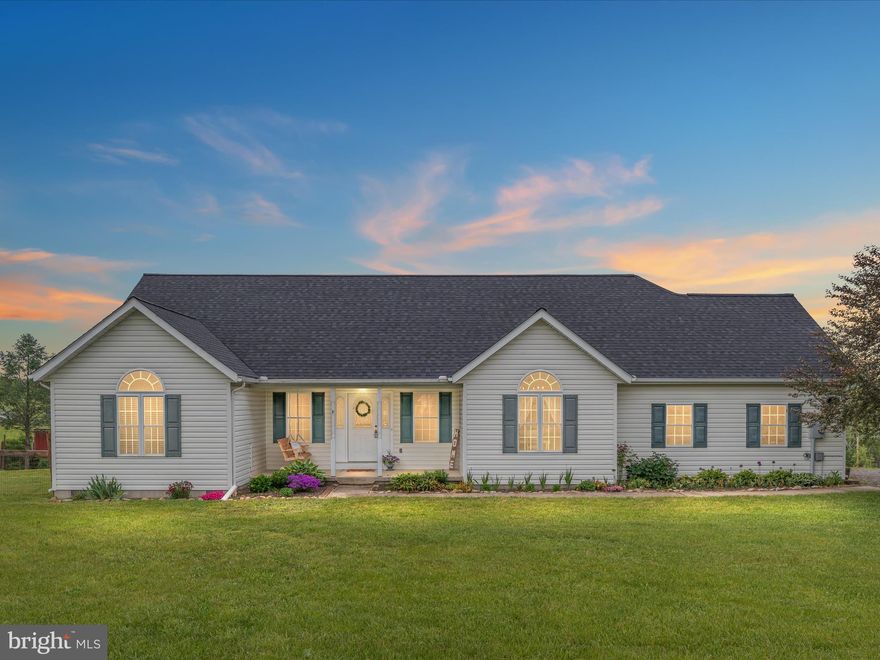 Second Chance on this home!! Don't wait to own this one level living less than 30 minutes from Winchester! Almost 1900 sq. ft. of living space on 2.4 acres. You will love the view from the back deck! There are great spots in the home to have morning coffee and look at the landscapes out the windows. Very peaceful setting.  Vaulted ceilings. Large family/living room opens to well equipped kitchen  w/island and tons of cabinetry.  This home has a split bedroom floorplan - Primary suite on one side and other nice sized bedrooms on other side of home.  The primary suite also has deck access, luxury vinyl plank flooring,  a large walk-in closet and separate primary bath. The second and third bedrooms have new carpeting. Hall bath has been updated.  HVAC replaced in 2021. New roof.  Starlink for internet. Whole house filter and water softener.  Make this your place to call HOME!