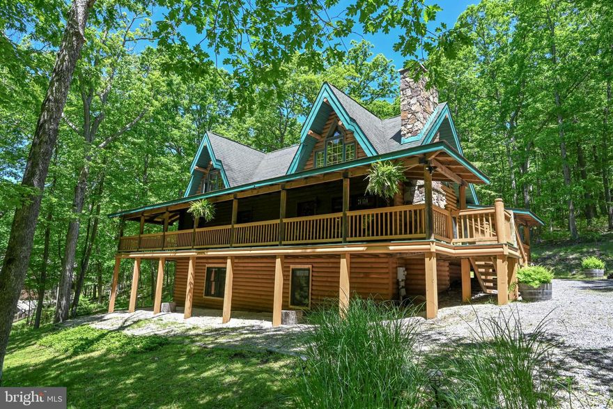 Embrace the serene mountain lifestyle with this enchanting log home, perfectly situated near the beautiful Deep Creek Lake! This stunning log home, featuring breathtaking cathedral ceilings and a floor to ceiling wood burning stone fireplace.  Open concept living with the dining area off of the charming kitchen with an island. Two main level bedrooms with beamed ceilings located near a wonderful bath and a separate room laundry area conveniently located off of the bath. The private upper level features a cozy loft and primary suite.  Wake up every morning to the magnificent cathedral beamed ceilings in this luxurious upper-level primary bedroom.  It features a relaxing ensuite bathroom with a soaking tub and a separate shower.  A walk-in closet with cathedral beamed ceiling completes the picture.  The fantastic lower level was recently finished with a spacious recreation room, a wet bar and a fridge.  Also there is a wonderful private bedroom and a beautiful bath!  Sky Valley has 3000' of "State Park Like" common lakefront, 3 swimming platforms with roped off swimming.  The boat dock area is a no wake cove.   Explore the neighborhood on your golf cart or ATV!  For the golfers in the group, it is only 5 minutes to Thousand Acre Lakeside Golf Course.  Find out more about this Secluded Lake Access Community in the Mountains of Western Maryland at skyvalleydcl.com.  This wonderful home combines rustic charm with modern comforts, this property is your gateway to tranquility and adventure.  Scheduled your private showing today!