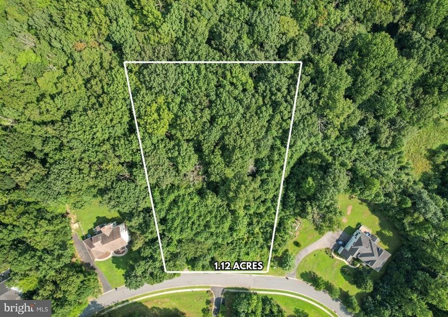 Build the home of your dreams on this 1.12-acre estate lot. This lot allows for a full walk-out basement with a potential in-law suite and a gravity septic field. This partially wooded lot is located in the beautiful Villages of Elk Neck community and backs to private woods. Enjoy the secluded feel of the neighborhood, with the convenience of being close to parks, marinas, local downtown restaurants, and shops. The property is 15 minutes from Elkton & North East and 45 minutes from Wilmington, DE. Bring your custom builder. No builder tie-in. Buyer/Builder should consult HOA docs for community guidelines. HOA docs are provided in the documents section. Contact Aspen Property Mgmt for updated HOA information. The Perc plan was approved for a 4 BR home with a recorded plat and previously permitted for a 5,284 square foot home with private sewage and water supply. This lot had a final grading plan and survey done by Northern Bay Planning with standard erosion and sediment control plans.
