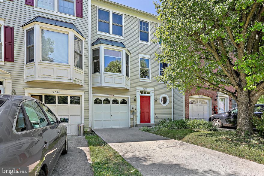 This is the one you've been waiting for!  This lovely turnkey garage townhome features a modern, neutral palette and is ready for new owners.  Three fully-finished levels include new luxury vinyl plank flooring and carpeting throughout,  updates in every room, fresh paint in every room, modern lighting, and a new roof.  The open floor plan offers an abundance of light.  The inviting main level family room features a gas fireplace with an adjoining powder room, a walk-in closet, and a walkout rear exit onto the lower deck.The mid level includes a spacious kitchen with a large island, white cabinetry, and a separate pantry for storage; plus an expansive living room with a bay window. Upper level features include a primary bedroom with cathedral ceiling, a walk-in closet, plus an en-suite primary bath. Two additional bedrooms and a full bath complete the upper level. The rear yard is lined with trees and offers both an upper and a lower deck, which provide the perfect place to relax and unwind.  There's nothing left to do but move  in!