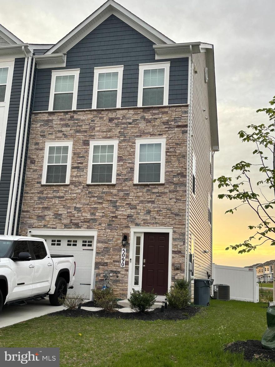 MODEL HOME QUALITY on this END of group TOWNHOME! Practically BRAND NEW condition! So close to everything! Stunning GOURMET kitchen w/QUARTZ counters,  LARGE island, 42" cabinets, HUGE dining area w/SLIDERS to VINYL deck & railings,, SS appliances- GAS stove and pantry.  EXPANSIVE family room with HIGH ceilings and LUXURY vinyl flooring throughout main level.  Powder bath completes the main level.  Upper level is host to GRAND sized primary bedroom with WALK-IN closet and ceiling fan. PRIMARY BATH includes double sinks and WALK-IN shower.  Two additional ROOMY bedrooms with lots of windows for NATURAL light.  Hall bath with QUARTZ sink and ceramic tile DEEP tub.  LAUNDRY is located on upper level too! Lower level is comprised of  COZY family room w/slider to lower deck, FULL BATH, storage closet, and access to ONE-CAR garage.  Backyard is contained with new VINYL fence.  END unit supplies you with SIDE windows for added natural light! All this in practically BRAND NEW condition!  Hurry up and make this WONDERFUL home yours so you can ENJOY all the WONDERFUL amenities in this SWEET neighborhood!