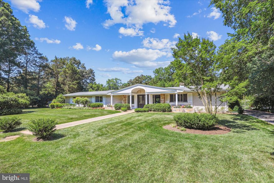 Simply stunning and expansive, one level home, situated on coveted West Boulevard Drive, just across from the bike/walking path along the GW Parkway; and steps to parks and the Potomac River. A truly spectacular and picturesque location, minutes from Old Town Alexandria, National Airport, DC, National Landing and Fort Belvoir. The lush lot is paradise, and is over half an acre, with an amazing in-ground pool, with a soothing water feature, and a relaxing spa/hot tub. Step into the delightful foyer with lovely marble tile floor, and make your way into the spacious living room with high ceilings, recessed lights, crown molding and pretty hardwood floors. From the living room, your eyes are drawn to the wall of glass doors which lead to the fabulous screened porch/Florida room addition that overlooks the patio and pool; and which is a wonderful extension of the homes living space. It's all perfect for relaxing, entertaining, and gathering with friends and family. The airy screened porch addition has soaring cathedral ceilings, pristine travertine tile floor, and ceiling fan. A dining area off the beautiful kitchen, flows seamlessly into the family room, which has a cozy wood burning fireplace. And adjacent to the family room is a powder room. Kitchen has maple cabinets, breakfast bar, gorgeous quartz countertops, recessed lights, and stainless steel appliances with gas cooking. There is also an elegant, ample sized dining room, which has large windows with views onto the serene front yard. The four generously sized bedrooms all have luxury carpet, vast Anderson windows for an abundance of natural light, and plentiful amounts of closet space. The primary bedroom is a true retreat, with a sitting area, wall of closets, a primary bath with double sinks and soaking tub, a door to the patio and pool, and access to one of the other en-suite baths. Two of the other bedrooms also have en-suite baths with tub/showers, and with a dual entry. Meticulously maintained, and the finest in one level living! Charming front porch, attached two car garage with extra storage; and a long repaved driveway with paver border, which continues through to a second, rare private entrance from Lee Ave. Garden shed with electric, and lovely grassy area for playing, resting and relaxing. A backyard oasis! The refreshing, luxurious 50 ' gunite pool has been replastered, and has a relaxing six person spa. Both pool deck and patio are surrounded with beautiful travertine tile. Newer HVAC. Situated in the sought after Waynewood Elementary school district, and just minutes to shops, restaurants, pools, grocery, neighborhood Farmer's Market's, recreation, Metro and more! Bike/walking trail just outside your front door. Jog or bike into Old Town! A truly special home.