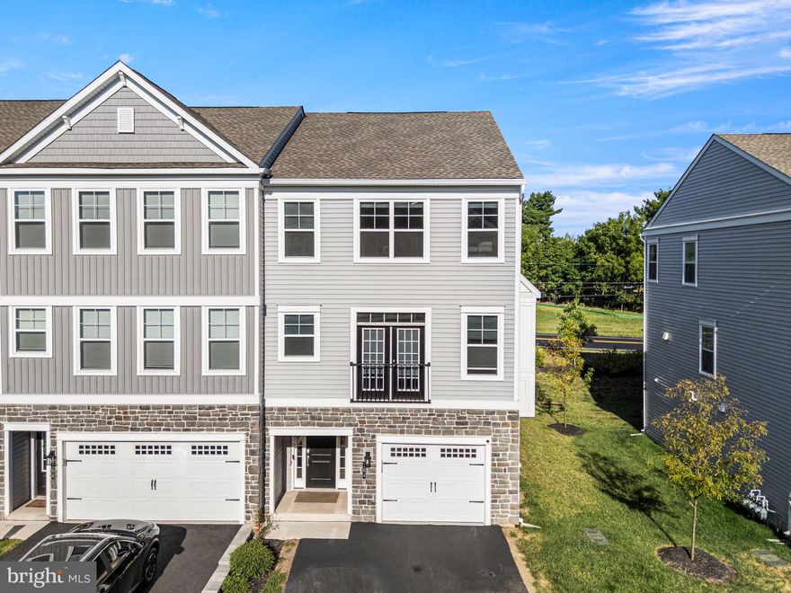 Welcome to 164 Larrabee Way, this exceptional Warwick Model (Largest in the community) end-unit townhome offers a truly rare setting, located in the only row of homes with unobstructed views of Limerick Community Park, providing scenic vistas and a level of privacy unmatched within the community. The home’s east-west exposure fills the space with abundant natural light throughout the day, from bright mornings to warm evening sunsets.

Built in 2021, this nearly new home blends contemporary design with thoughtful functionality across multiple levels. Upon entry, an elegant oak staircase with American Craftsman posts and white square balusters leads to the main living area. The open-concept main level features engineered oak hardwood flooring and warm, neutral tones, seamlessly connecting the living room, dining area, and kitchen—ideal for both everyday living and entertaining. The dining area is enhanced by a bay window, adding character and additional natural light.

The living space includes a separate coffee bar with cabinetry, creating a perfect everyday convenience. The kitchen showcases 42" cabinetry with crown molding, granite countertops, and an impressive 8-foot island with seating, ideal for casual dining and gatherings. Sliding doors lead to the deck overlooking the park, while the covered patio below the deck remains dry during rain, offering year-round outdoor usability.

What truly sets this home apart is the private rooftop deck, a feature found in only one home in this entire row. Designed for entertaining and relaxing, this rooftop retreat is paired with an adjacent flex room with storage and a separate HVAC system, offering incredible versatility. This space can function as a 4th bedroom, guest suite, home office, media room, or fitness room—an extremely rare and valuable option.

The second floor features a spacious primary suite with a cathedral ceiling, walk-in closet, and a spa-like en-suite bath with a double-bowl vanity, ceramic tile flooring, and a large shower with ceiling-height subway tile and a built-in bench. Two additional bedrooms, a full hall bath, and a convenient second-floor laundry complete this level.

The finished lower level provides additional flexible living space with access to a ground-level patio, making it ideal for a media room or family room.

The attached one-car garage offers everyday convenience and includes built-in overhead storage. Additional upgrades include a whole-house humidifier, air purifier/filtration system, and water softener. Both HVAC systems are equipped with Honeywell media air cleaners—Honeywell 200 for the main furnace and Honeywell 100 for the attic heat pump—providing enhanced air quality and comfort.

Located in the highly regarded Spring-Ford School District, this home offers easy access to Route 422 and major roadways and is approximately 20 minutes from King of Prussia for premier shopping and dining. Community access leads directly to 70 acres of parkland with trails, courts, playgrounds, and recreational amenities. 

Welcome home — and make it your own. Showing starts on Saturday, Feb 28, 2026 - Open House  11AM - 1PM