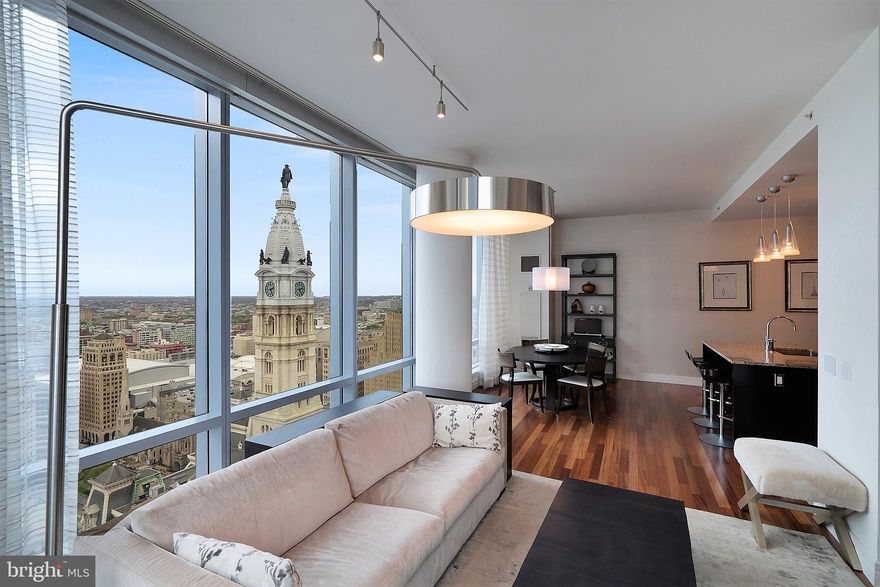 FIVE STAR LUXURY LIVING AT THE RESIDENCES AT THE RITZ CARLTON - This exceptionally upgraded two bedroom, two and a half bath residence with incredible views of City Hall and Dillworth Park is not to be missed! The living and dining areas offer soaring ceiling heights, gleaming hardwood floors, and walls of windows which flood your space with an abundance of light. The chef's kitchen features granite countertops, DORNBRACHT fixtures, and VIKING, SUBZERO & MIELE appliances. The primary bedroom is generously proportioned and boasts ample closet space. The primary marble bathroom showcases double sinks with storage vanities, an oversized walk-in shower with frameless shower door, and a large BAIN ULTRA soaking tub. On-site GARAGE PARKING, motorized shades, custom closets, and a multitude of discerning upgrades complete this elegant pet-friendly residence. Association fees include a 24/7 concierge, chauffeur-driven car service, state of the art fitness center, pool with hot tub, and residents' lounge with outdoor terrace. Perfectly situated in the Rittenhouse and Avenue of the Arts area, this deluxe residence is steps away from fine dining, one of a kind shopping, world-renowned cultural destinations, and exciting nightlife.