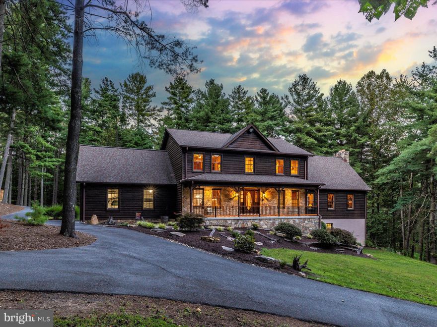 Prepare to be mesmerized.

Tucked away near Mar Lu Ridge’s 500 acre preserve, lives a stunning Hemlock sided warm cabin like home exuding privacy, luxury, comfortable “at home opulence” and serene peaceful nature.  This stunner is between  the quiet and desirable community of Jefferson and Route 15 leading into VA, WV and the rest of gorgeous Frederick county.  While living so peacefully on acreage and surrounded by breathtaking scenery, it’s an anomaly that you can reach the MARC in less than 10 minutes.  You can cross into lovely Lucketts, VA in about the same.  This is the perfect location. Welcoming you home is a quiet tree enclave  and 1000 feet of paved and sealed blacktop circular driveway.  Pull right into an oversized 2 car garage with storage and enjoy the convenience of walking right into your family organization center with deep custom built ins.  The laundry machines, storage and organization continue to perfect the “mud room” welcoming space.  The finishes are pleasing to include grey ceramic tile, white subway tile, rubbed oil bronze pot filler  and new appliances in the fabulous new kitchen.  A beverage cooler and double wall ovens situate alongside a bright quartz island.  The enormous deck with full time propane hard line for cooking on the grill are mere steps from the eat in kitchen and wine bar.  A deep sunken family room with sun-drenched windows, exterior doors and a massive stone fireplace create a natural calling to sit, stay and relax.  A study, spacious dining room and main level bedroom and full handicap accessible bath add options for wonderful carefree living and incredible entertaining.   The second floor is the perfect location for an owner’s retreat on its own hall and dedicated wing.  The sitting area boasts a light filled loft overlooking the family room and allowing the new owner to decide if it’s a craft day, a reading morning, a Sunday morning puzzle or just a fabulous coffee sipping spot.  The owner’s suite has a stunning tile shower and sunken tub with a separate water closet. A makeup table and dual vanity are anchors in the large devoted space.  Large linen closets and walk in closets are featured in the hall bedrooms alongside a gorgeous updated bathroom.  Plush carpet, bright cheery windows and million dollar views await from the 2nd floor vantage point.  The lower level has a dreamy workshop with drafting tables, ventilation, heating and cooling comfort, 10ft ceilings and an incredible operation for creating and designing.   Seeing is believing.  It’s *all* negotiable! There is an additional detached garage with a hideaway roll up door, ventilation and a hanging heater steps from the rear deck of the home.  Carport storage, deer feeders, 3 propane tanks, a whole house generator and 3 heating and cooling systems are a few of the amenities worthy of remarks.  The list goes on.  We have sitting porches to appreciate galaxies, meteor showers and the enormous solar system unencumbered by light.  Nature is at home on Mountville road where you’ll see turkeys, deer, black bears, eagles and more! Welcome Home to peaceful 4414 Mountville Road.  A full list of unbelievably detailed and meticulous amenities is available for your thoughtful review while you enjoy a very special tour.