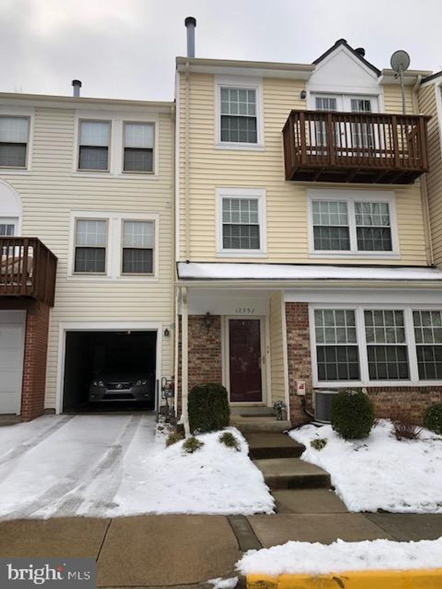 Beautiful, freshly painted 3 bedrooms 2 1/2 bath townhome with a 1 car garage. Hardwood floors on the main level entry. Large living room with step up to the separate Dining Room. Kitchen has newer (2017) stainless steel appliances -  built-in microwave, gas stove, dishwasher and refrigerator. Pantry for extra food space. Half bath on the main floor. Upper level has two bedrooms, one full bath and laundry area with washer and dryer included. 3rd floor is a huge Primary bedroom with a fireplace, built-ins, primary bath en-suite, walk-in closet and balcony .  New windows 2018. New HVAC 2017 and new Water Heater 2019.  Water and trash included in COA fees.  Three swimming pools, clubhouse, and walking trails.   The community offers plenty of amenities nearby.  Occoquan Historic District is only a few minutes away.  10 minutes to the  Horton commuter lot.