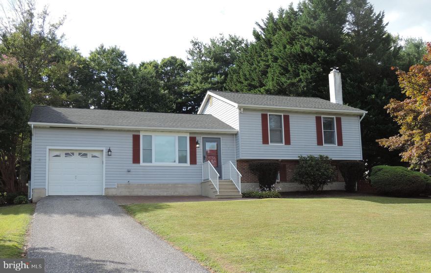 WELCOME HOME!  This 3 bedroom, 2 full bath Split Level  is move in ready!  Living room, spacious eat in kitchen, family room includes a fireplace with a wood stove insert and mantel, bonus room and laundry room.
Storage/utility room with plenty of storage space.  1 car attached garage.  Shed .  Deck and patio installed 2020, carpet installed 2020, front door & storm door installed Nov 2024 and new living room window installed Feb 2025.  This home is situated on a .34 Acre lot and NO HOA!