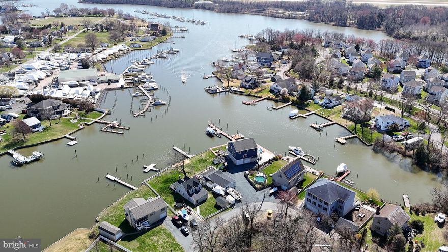 There are properties, and then there are locations. This is a location. Sitting directly on the shores of Middle River, this waterfront opportunity puts you right in the heart of one of the most sought-after water communities in the Baltimore area — where weekends are measured in boat rides, morning coffees on the dock, and sunsets that paint the sky in ways no camera can quite capture.
Step outside and you're on the water. A newer bulkhead keeps your investment protected, and a private dock extends right out to the river — tie up your boat, launch the jet ski, drop a line in the water, or simply sit and watch the world slow down. Middle River connects you to the Chesapeake Bay and all the boating, fishing, and crabbing that comes with it. This is the lifestyle people spend years searching for.
The views from this property are the kind that make you stop and take a breath. Whether it's the morning light dancing off the water, the boats drifting by on a summer afternoon, or those legendary waterfront sunsets rolling in over the horizon, this is a front-row seat to some of the best scenery the region has to offer. You simply cannot put a price on a view like this.
And when the sun goes down, the fun doesn't have to stop. Bengies Drive-In Theatre — one of the last great American drive-in experiences and a beloved Maryland landmark — is right around the corner. Catch a double feature and be back home on the water before the credits finish rolling. It's the kind of neighborhood detail that makes a good location a great one.
For the buyer with vision, this is the opportunity you've been waiting for. Waterfront lots with a private dock and newer bulkhead in this location are a rare find at any price point. Bring your ideas and your imagination — the water is already waiting.