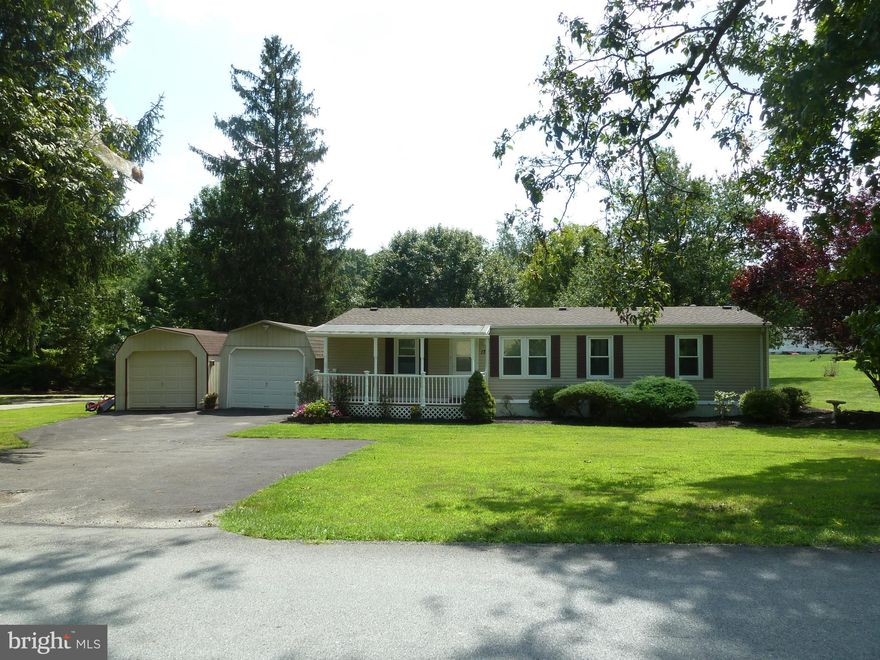 A little bit of country comes with this 3BR, 2BA double-wide located minutes to I83, Rt30, East York and Red Lion conveniences. Situated on an half acre lot with large paved driveway, detached 12x30 garage with opener, 12x22 detached garage and storage shed. A covered front porch welcomes you into the home with cathedral ceilings, living/dining room, large kitchen ample counter and cabinet space. There s also a master suite with private bath. Step out the slider to a deck, with Sunsetter Awning, overlooking a wonderful backyard where you can watch the birds. Ready for immediate occupancy! Hurricane anchor system when new. Roof approximately 5 years old. Replacement windows in 2008. AGENTS   Please read Agent Remarks!