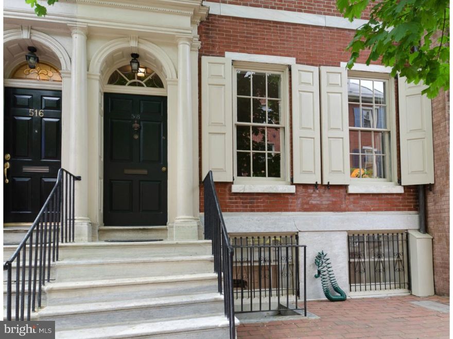 The current owners of this  historic single family Society Hill townhouse have updated it to meet the most demanding standards of comfort without sacrificing any  of its historic character. The result is an elegant townhouse (18x135) with a bright and airy layout that simply feels like home.   Welcome to 518 Pine Street!   Classic, historically significant Philadelphia townhouse built in 1805 in the Federal style  with many original features including wide plank, random-width honey Pine floors; arches with extensive architectural details, crown moldings, high ceilings and sun drenched spacious rooms. . Walk through the marble entry foyer  into the beautiful living room with traditional mantle frames and wood burning fireplace. There is a powder room and a central staircase.  The first floor rear is the open and airy kitchen  with  custom cabinetry and cherry tops; coupled with glass fronted custom cupboard in the dining area and  Pennsylvania blue stone flooring. Continue into the  a large sitting room  also with Pennsylvania bluestone flooring; exposed brick wall and  skylight with  in-laid leaded glass antique windows. French doors with huge fan window above  lead out to  the large, bi-level garden with brick patio. There are mature  trees and flowers in this very private and tranquil area. There is adjacent and secure 2 car parking. Master bedroom with high ceilings, large closet, big windows, very bright southern exposure and a wood-burning fireplace.   There is second room, used as a study, also with large windows and several closets. There is a hall bath.  The third level has  two large bright bedrooms and a full bath.     The forth level consist of 2 additional bedrooms with a  huge skylight, cathedral window and a full bath. The lower level basement is finished with a wood burning fireplace,original marble mantle, extensive closets and storage space.
