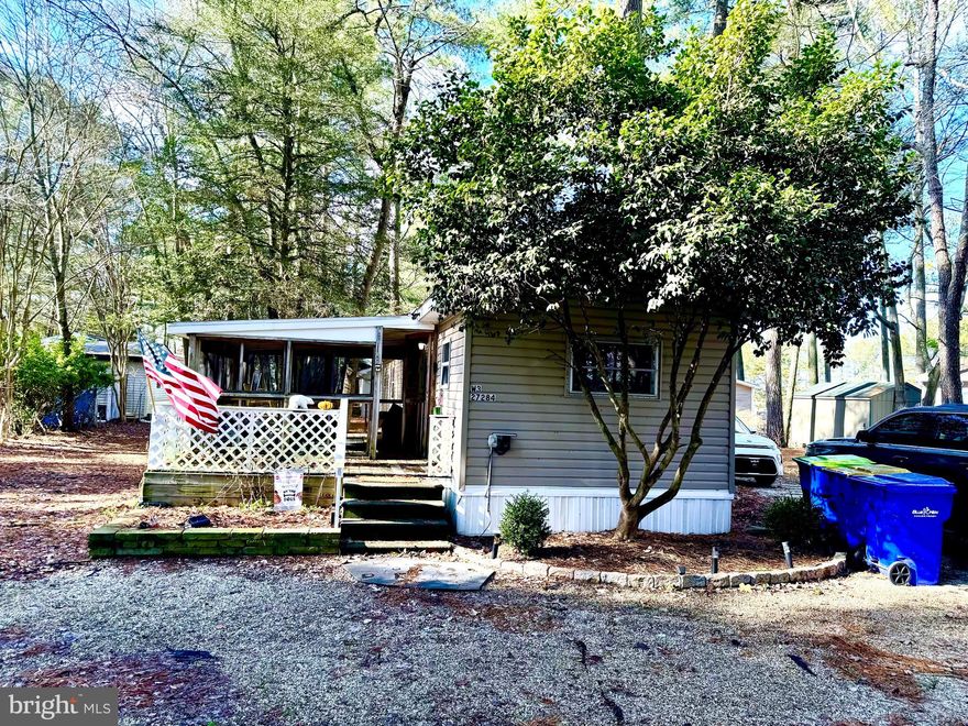 Nestled in the charming White House Beach community, this delightful mobile home offers a perfect blend of comfort and convenience. Built in 1975, this well-maintained single-wide home features 930 sq. ft. of inviting living space, ideal for those seeking a cozy retreat. Step inside to discover a warm and welcoming interior, highlighted by a combination dining and living area that encourages gatherings and relaxation. The kitchen, complete with a breakfast area, is equipped with essential appliances, including an electric oven/range, refrigerator, and washer/dryer, making daily living a breeze. Enjoy the comfort of ceiling fans throughout, ensuring a pleasant atmosphere year-round. The home boasts two spacious bedrooms and a full bathroom featuring a tub shower, perfect for unwinding after a long day. Outside, the property shines with a variety of outdoor spaces, including a screened-in porch and deck, ideal for enjoying the serene harbor views and gentle breezes. With 332.36 acres of land, this property offers ample parking with a gravel driveway accommodating up to four vehicles. Water enthusiasts will appreciate the private access to the Indian River, perfect for boating, fishing, or kayaking. This charming mobile home is not just a place to live; it’s a lifestyle waiting to be embraced. Experience the tranquility and community spirit of White House Beach today! This is a land lease community and park approval is required