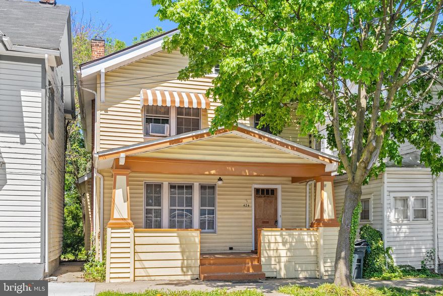 Lovingly maintained and modernized but still retaining that historic charm, this gem of a home is waiting for you!  The features that you will love are the hardwood floors throughout most of the home, the beautiful arched openings, the whitewashed brick fireplace in the living room and the incredible space on 4 levels!  Large kitchen, separate living and dining rooms, and offering 3 bedrooms, 1 full and 1 half bath on over 2000 finished square feet.  Enjoy outdoors on the front porch or rear screened porch, or in the nice sized fenced backyard.  Fireplace has a gas insert for cozy winters!