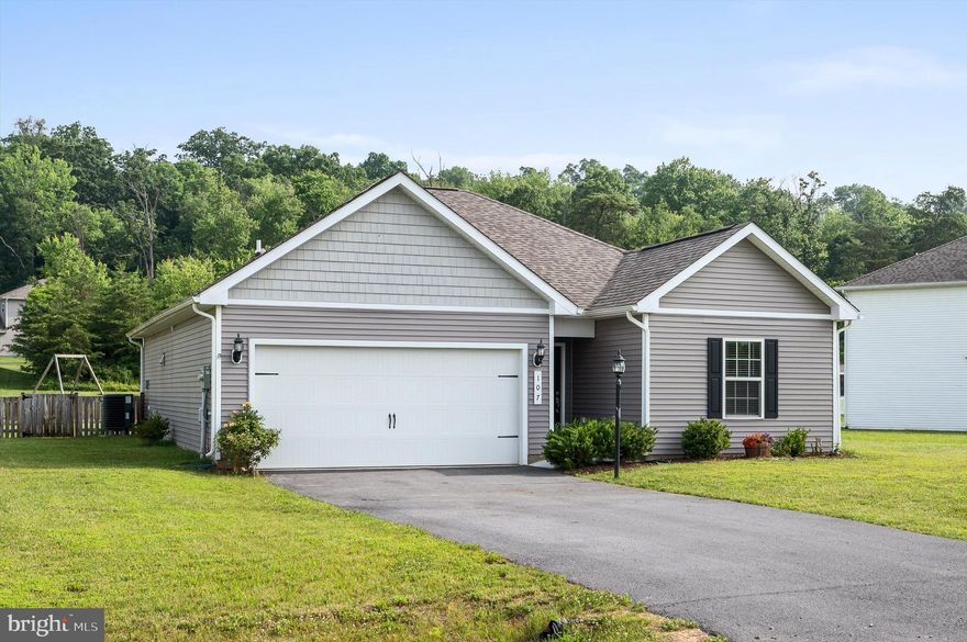 Welcome to your new home! 107 Rappahannock Run is a 3 Bedroom and 2 full bathroom one level ranch style home that is located right near the West Virginia and Maryland Border and is right next to the Potomac River. Excellent Commuter Location being just minutes from I-81. Upon arrival you will notice the charming curb appeal with mature shrubbery, front lamp post and a fenced in back yard. The section of shaker siding on the front of the home also adds a nice touch. Entering the home, you are going to find the two secondary bedrooms with shared full bath. The main living space in the home boasts an open layout of the kitchen, dining area and living room. The kitchen has granite counter tops, stainless steel appliances, nice sized corner pantry and an overhang on the counter top for an eat at bar. Don’t miss the NEW Carpeting!  Off of the living area is a laundry room, and access to the 2 car garage. On the other side is the Primary Bedroom that has its own en suite. Tile shower, walk in closet and built in linen shelving can be found here. Out back of the home you will find a patio and the fenced in yard. The Community offers access to the Potomac River by concrete boat ramp, a river side park with playground, Gazebos, basketball court, soccer field and a bath house! Call today for more info or to schedule your tour!