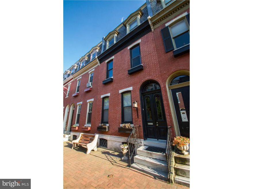 Immense scale and charm lies within this 4 bedroom, 2 bath Graduate Hospital "Garden Block" home! Grand vestibule entrance with tile floor and soaring ceilings. Spacious living room offers two windows, high ceiling, hardwood flooring, ornate door trim and built-in shelving. Next you'll find the formal dining room, and the kitchen which features a tile floor, stainless steel appliances, an abundance of cabinetry and counterspace and a door leading out to a wonderfully charming private rear yard with decking- simply perfect for relaxing or entertaining! On the second floor you'll find two bedrooms with plenty of natural sunlight and closet space, one with a walk-in closet with stackable laundry and a gas fireplace. Off the hall is a bathroom with large soaking tub, window, subway tile and pedestal sink. The third floor features two more bedrooms and an additional full bathroom with two windows, two pedestal sinks and a large clawfoot tub with showerhead. The basement is perfect for storage. This home is beaming with Philadelphia character and located on an unbelievably beautiful and highly sought-after block, convenient to all that Center City has to offer!