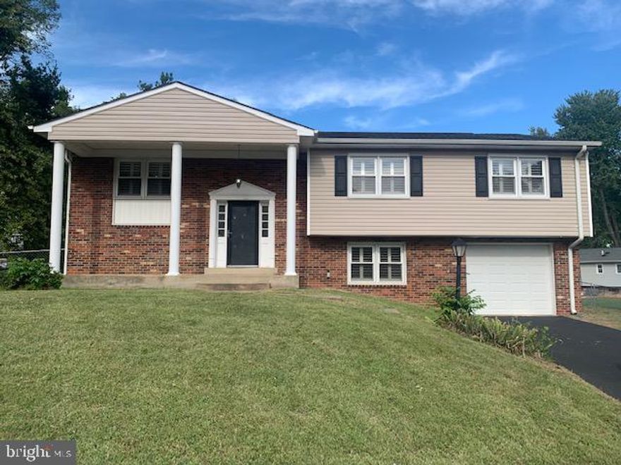 Absolutely stunning home. Freshly detailed & cleaned. Allergen Free with hardwoods and ceramic tile throughout.  You'll love the European flair kitchen with its unique open style. All rooms provide white wood plantation blinds.  The kitchen sliding glass door leads to a back yard deck and the lower-level great room has another sliding glass door leading to the back yard patio.  Bathrooms are all updated with the same tile floor and surround.  It's very neutral and generously sized.  With the huge, fenced backyard and covered front entrance, there's plenty of room for privacy on this cul-de-sac lot.  This home even provides a long driveway/parking pad plus an attached garage with opener.  Pets accepted on a case-by-case basis w/non-refundable deposit.   Yard maintenance included in monthly rent (mowing, weeding, limb trim...).  If you're looking for a lease term longer than 12 months, the landlord has been known to extend after the 12th month.