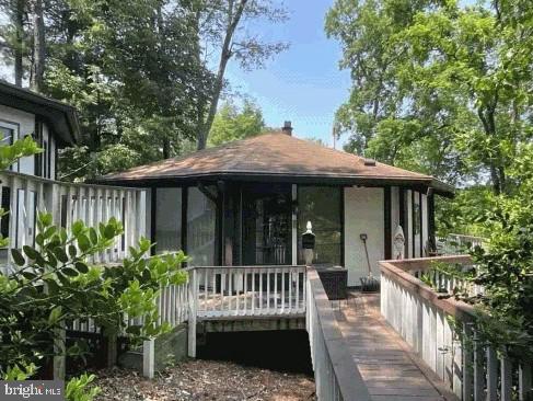 This property is truly an investor's dream! Featuring a tenant committed to leasing for a minimum of one year, this stunning octagon shaped house offers more than just a unique architectural design. Located on picturesque Lake Linganore, the home boasts its own pier—perfect for relaxing afternoons by the water or fishing trips. Includes all season Octagon Shape Gazebo. The picturesque view of the lake can be seen from the gazebo and from the floor to ceiling windows in the home. Whether you envision this property as a private retreat, a vacation rental, or a profitable Airbnb, its charm and prime location make it an ideal investment opportunity for both personal use and income potential.
