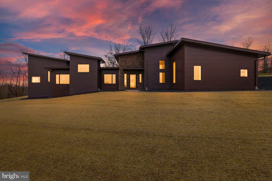 Welcome to Lot 2 in Tim Hatfield’s Agrestic community, a thoughtfully designed enclave blending modern architecture, luxury living, and cutting-edge sustainability. Ideally located along Route 27, this home offers the perfect balance of peaceful countryside living with easy access to the region’s major hubs—just 90 minutes from Washington, D.C. and under an hour from Baltimore.

This striking modern luxury smart home has been meticulously engineered to deliver a near net-zero energy lifestyle while maintaining exceptional comfort and design. Built using insulated concrete form (ICF) construction, the home offers superior structural integrity, energy efficiency, and sound insulation compared to traditional construction.

A sophisticated energy system powers the home, featuring solar panels paired with a Tesla Powerwall along with a geothermal heating and cooling system. These technologies work together to dramatically reduce energy consumption, with projected peak summer and winter utility costs expected to remain under $30 per month.

Architectural details make this home truly unique. Dramatic rooflines, exposed wooden trusses, and industrial-inspired spiral ductwork create a bold yet inviting aesthetic. The exterior showcases a refined mix of  modern siding, and a durable 50-year standing seam metal roof, designed for both beauty and longevity.

Inside, the home offers 3 spacious bedrooms with the option for a fourth, expansive living spaces, and a seamless layout designed for modern living and entertaining. The property also features a beautiful three-car garage with insulated doors, providing ample space for vehicles, storage, or hobbies.

Connectivity is already built in with high-speed Ting fiber internet pre-wired throughout the home, ensuring fast, reliable service for work, streaming, and smart home technology.

Currently under construction, the home offers buyers the rare opportunity to select all interior finishes, allowing you to personalize the final design while enjoying the benefits of an advanced, energy-efficient modern home.

Lot 2 at Agrestic represents the future of luxury living—sustainable, sophisticated, and designed to perform.