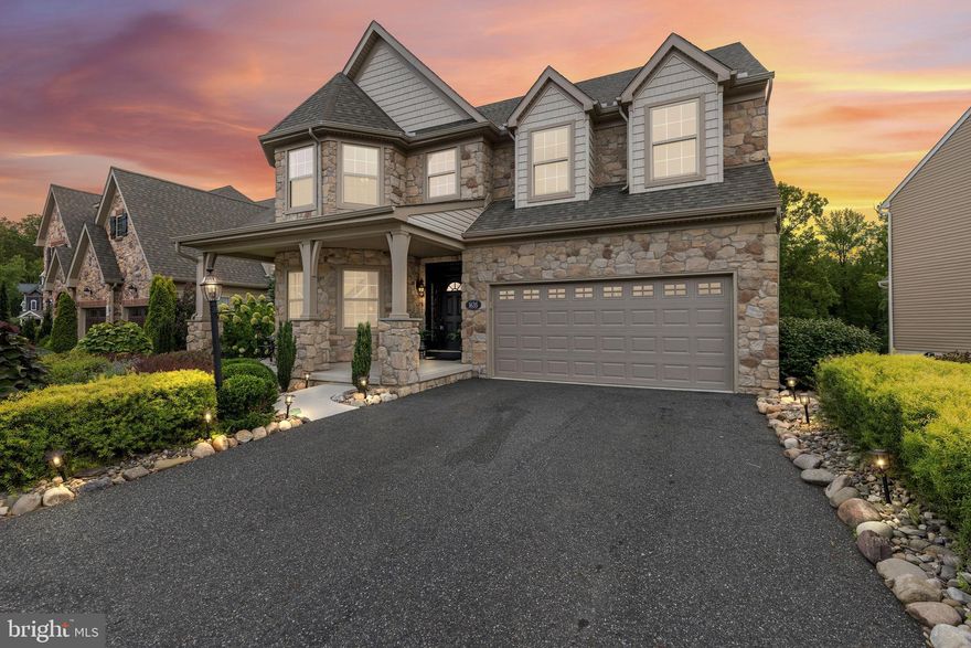 Set behind professionally designed landscaping and striking stonework, this beautifully appointed home blends architectural presence with modern livability in one of Havre de Grace’s most desirable communities. Rich hardwood floors, crown molding, and abundant natural light create a warm yet refined atmosphere from the moment you enter. A private front study offers the perfect work-from-home retreat, while the expansive dining room is ideal for hosting everything from intimate dinners to holiday gatherings.

The chef’s kitchen is thoughtfully designed for both everyday living and entertaining, featuring double wall ovens, a cooktop with built-in microwave, granite countertops, tile backsplash, upgraded appliances, an oversized island with seating, a separate coffee bar, and an exceptionally large butler’s pantry. The open layout flows seamlessly into the living space and out to the composite deck and screened-in porch overlooking a fully fenced yard, creating effortless indoor-outdoor living.

Upstairs, four spacious bedrooms provide comfort and flexibility. The expansive primary suite serves as a true retreat, complete with two walk-in closets and a stunning upgraded spa-inspired bath featuring a large walk-in shower, soaking tub, and double vanity. Convenient upper-level laundry adds everyday ease, with an additional laundry area located in the lower level.

The fully finished walkout basement offers exceptional versatility with a private bedroom and en-suite bath, an additional den, and a well-appointed kitchenette with sink, microwave, refrigerator, and counter space. This space is ideal for multigenerational living, extended guests, or flexible lifestyle needs.

Additional highlights include a tankless gas water heater, electric HVAC with new A/C installed in 2023, architect-designed drainage for long-term peace of mind, a two-car garage with app-enabled access, and a Choice Home Warranty that conveys. This home delivers space, sophistication, and thoughtful upgrades throughout in a setting that balances privacy and community.