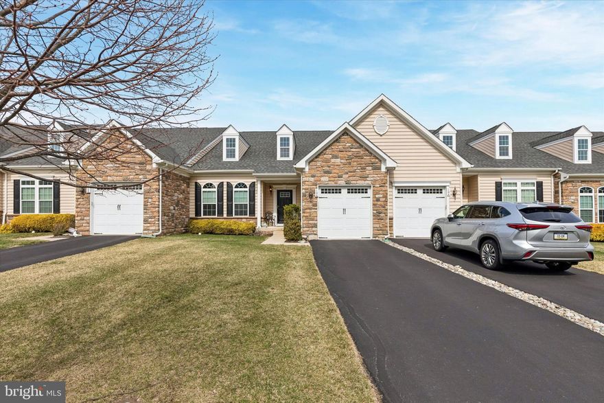 Located within the gated 55+ community of Stony Creek Farms in Worcester Township, this immaculate three-bedroom carriage home offers a thoughtfully designed floor plan with single-level living at its core. The first-floor primary suite features a walk-in closet and full ensuite bath, while the modern kitchen with granite countertops opens to a low-maintenance composite deck. A laundry room with storage and powder room for guests add to the convenience on the main level. Cathedral ceilings lend an impressive sense of openness to the main living area. Upstairs, two additional large bedrooms with generous walk-in closets and an additional full bath await. The full unfinished basement offers plentiful storage, an updated sump pump system, and endless possibilities for additional living space should you decide to finish it. Stony Creek Farms is a Gold-Star designated 55+ community offering resort-caliber amenities including a heated outdoor saltwater pool, hot tub, fitness center, clubhouse, and three miles of maintained walking trails. HOA services include driveway and walkway snow removal, ensuring true ease of ownership year-round. 106 Shire Drive is your opportunity to enjoy refined, maintenance-free living in one of Montgomery County's most sought-after active adult communities. Make your appointment today.