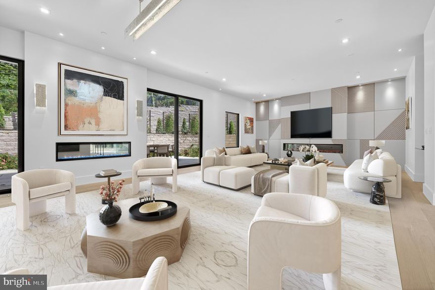 NEWLY PRICED! Stunning brand new, ground up 2025  build on one of the last available lots in the prestigious Foxhall Corridor!  Located just minutes from the business and cultural centers of Washington, this property sits in a quiet, private enclave near several Embassy residences and just steps from one of Washington's most expensive sales in history.  While the exterior is inspired by the late renowned architect Arthur Cotton Moore, the interior is a glamorous 6700+ square feet of exceptional entertaining and living space, with the highest level of finishes available today.  Sited on a third of an acre, this light-filled and elegant home features 5 bedrooms, each with an ensuite bath,  an open-concept kitchen/ family room,  a banquet-sized dining room, a gym with a sauna, a home office, a theatre and an elevator to all levels.   Outside a large terrace with a fountain and tiered landscaping provide privacy.  A two-car garage with two plug-in electric car chargers and additional parking complete this special offering.