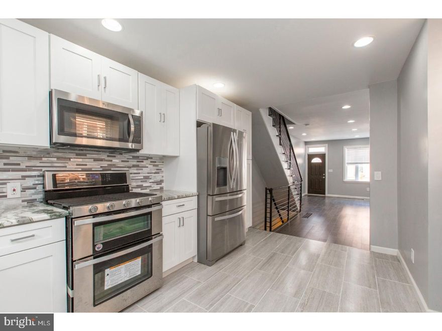 Welcome to 1740 Sigel Street — a stunning 3-bedroom, 2-bath home in the heart of Newbold. This beautifully renovated property stands out with its spacious layout, modern finishes, and prime location near Passyunk Square, Point Breeze, and top dining spots. The open main floor features hardwood floors, recessed lighting, and a chef’s kitchen with white shaker cabinets, granite countertops, tiled backsplash, and a full stainless steel appliance package. Upstairs, enjoy three spacious bedrooms and a luxurious 4-piece bath with a glass shower and jetted tub. The fully finished basement adds versatile living space, a second full bath, and laundry. Outside, a private fenced yard offers the perfect escape. Just steps from SEPTA, highways, and local favorites like SP Tap Room and Ultimo Cafe—this home is move-in ready and waiting for you!