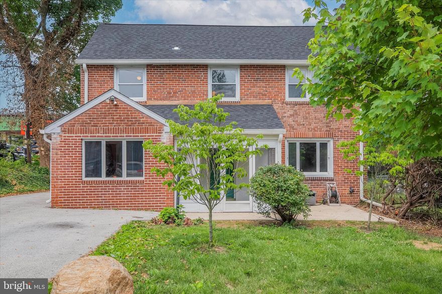 Welcome home to 522 S Woodbine, a beautiful 5-bed, 3-bath home nestled in the Penn Valley neighborhood of Narberth. Located in an award-winning school district, it also has prime access to restaurants, shopping, and three parks with playgrounds, making this home extra special. The train, bus, and I-76 are all easy to access. Dream of working from home? This is a rare opportunity to own a residential property zoned for commercial businesses.  This home has been lovingly cared for by the current owners, and the major components of the home have been upgraded in the past 3 years, giving the new owner peace of mind! From the moment you pull into the oversized driveway with 5 parking spaces, you will be impressed by the new roof (gutters and relined chimney) and the classic brick exterior. Stepping into the glass porch and through the front door leads you into a large living room that receives tons of sunlight and features hardwood flooring, gorgeous fireplace with brick surround & wood mantel, and calming blue walls that pop against the white trim. The hardwoods continues into the dining room that opens nicely to kitchen. This layout is great for those who enjoy entertaining! Whip up dinner while still being a part of the table conversation. The first of three full bathrooms is located in this room. The spacious kitchen is sure to please with all the open counter and cabinet space. LVT flooring was installed throughout and blends nicely with the granite countertops, wood cabinetry and tile backsplash. S. S. appliances include a gas range, dishwasher, and a French-door Maytag refrigerator. A built-in pantry provides all the space you need for dry goods and includes a separate bank of cabinetry for even more storage and prep space. For those who enjoy their morning latte or have a nice wine collection, could easily transform this area into a coffee/wine bar. The spiral staircase provides a second method to get to the second-floor hallway, and a side door leads to the spacious backyard. Through the dining room, enter into a unique space that has been used as a small business, an in-law apt, and now a live-in nanny suite! With a pitched ceiling, 2nd full bath with walk-in shower, and a storage space (kitchen with only cabinets left), those seeking a first-floor bedroom have the opportunity to easily create a massive primary suite. A bonus room, formerly the in-law apartment living room, is currently used as a first-floor laundry. The best part? This separate wing has its own outdoor access and includes direct access into the main home (through the dining room). There are so many possibilities for use with this layout! Add a home gym, office, TV/media room, you name it! The remaining four bedrooms and gorgeous third full bath are all located on the second floor. Each bedroom comes complete with beautiful hardwood flooring, neutral paint, and roomy closet space. The full bath was just renovated this year and is truly a dream. Updates include the new heated floor, new vanity, all new lighting, custom tile surround for the deep tub/shower, and top-of-the line Kohler fixtures. Is a large, fenced-in backyard a must? Check it off the list! This open space awaits your vision! An open shed which is currently being used for storage can easily be converted into a covered entertaining space. A concrete patio provides plenty of room for a table set for outdoor dining, and there are countless ways to utilize all the open grassy space. Extend the patio, create garden beds for those with a green thumb or keep open to enjoy yard games or to allow furry family members to run around. In addition to the new roof, the major components that have been updated include an ecofriendly HVAC system with a high-efficiency furnace, whole-house central AC (dual zone), new blown-in insulation, smart thermostats, , a new sump-pump with backup, and a new electric panel. All the hard work has been done, all you need to do is move in and start decorating!