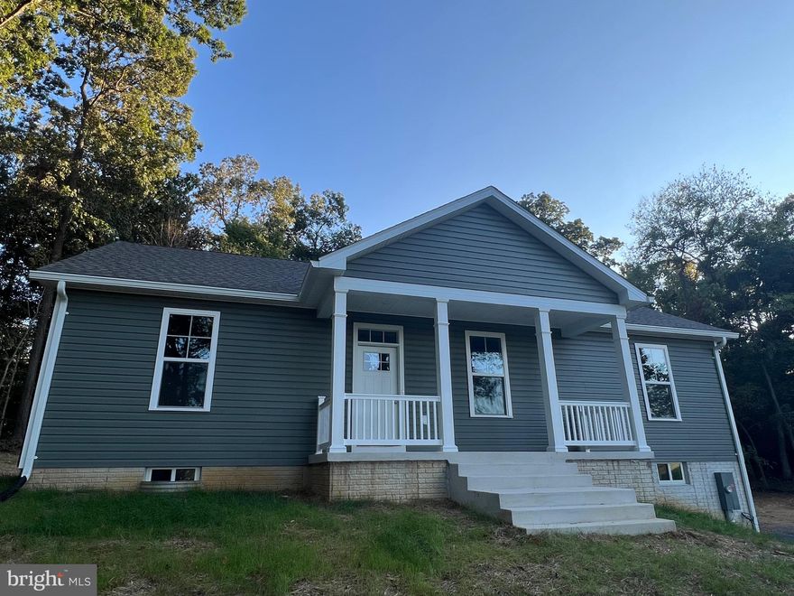 NEW CONSTRUCTION 60 days from completion!  No HOA on 1.3 unrestricted wooded acres minutes outside of Shepherdstown! One level ranch home hosting split bedroom plan with three bedrooms and  two full bathrooms with open living/kitchen/dining layout.  Kitchen will boast white cabinets, island, granite countertops, and stainless appliance package.  Open living/dining space with cathedral ceilings and main living area w/ LVP flooring selection and electric fireplace.  Primary bedroom suite offers walk-in closet and full bathroom w/ tiled walk-in shower.  Additional finished space in the basement with full bathroom. Enjoy sipping sweet tea from covered front porch.  Just minutes from the conveniences of town w/ shopping, restaurants, and medical facilities nearby. Purchaser responsible for paying transfer tax stamps.  Photos are current as of 7/3!