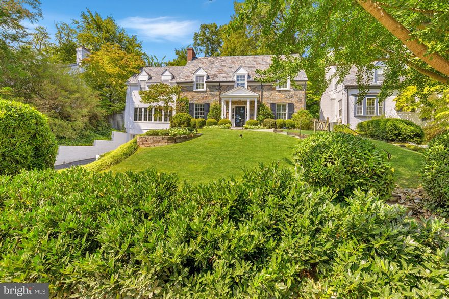 OPEN SUN 9/14 2-4PM! Beautiful stone Colonial on tranquil block of desirable Kent set on large and elegantly landscaped lot. Main level features foyer, former living room with fireplace, dining room, kitchen with adjoining breakfast room, powder room, and large family room with walkout to lovely patio with fireplace, terraced gardens, and flat yard space. The second level features three bedrooms, each with en suite bath, including an expansive primary suite with dressing room and en suite bath with separate soaking tub and shower. Lofty third floor features flex bedroom/bonus room space. Lower level features large family/rec room with fireplace, bedroom, full bath, plentiful storage, and access to the home's attached 2-car garage with additional driveway parking.