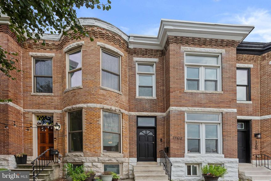 Updated Riverside home with PARKING and a rooftop deck.  Enter the home into the living and dining rooms, continue to the kitchen and finish in the bonus family room/den at the rear of the main level.  Living and dining rooms feature wood flooring and exposed brick.  The updated kitchen has granite counters and a main level washer/dryer.  The bonus room on the main level makes for a great home office or TV room with a convenient half bath.  The upper level has an updated full bath, two large bedrooms and bonus room that would make for a great walk-in closet or work from home space.  Exit the rear bedroom to relax on the two tier rooftop deck with sweeping city views.  Walk to Riverside Park, two shopping centers, local restaurants and more.  Fresh paint throughout, shows well.