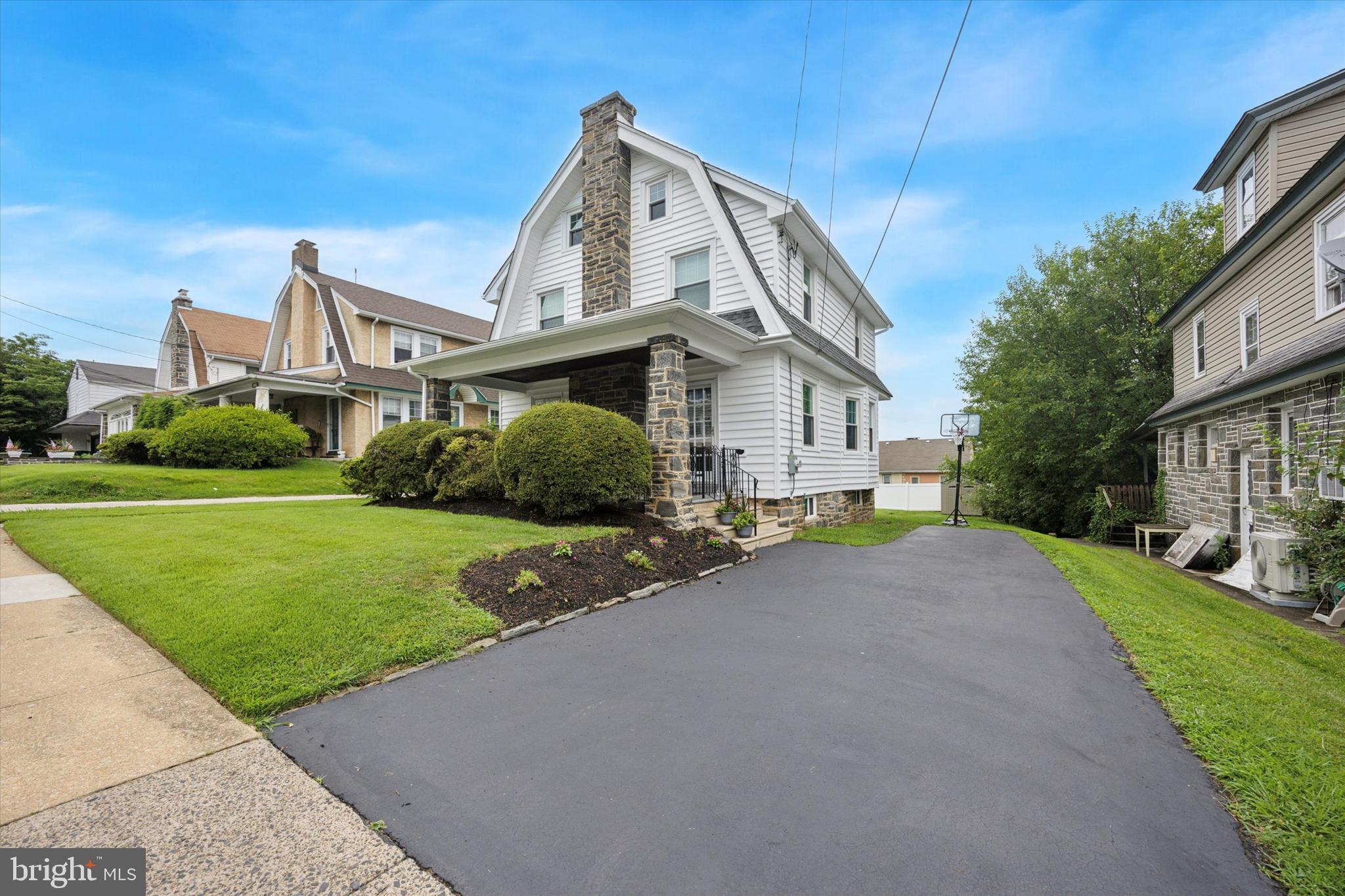 Classic Stone Colonial that has been renovated from top to bottom and is highlighted with Detailed moulding throughout along with solid wood doors . As you approach this well cared for home you are greeted by a welcoming front porch with stone columns, landscaped surroundings and a timeless wrought iron railing complimented with a tongue and groove traditional ceiling. The option of two separate French entrance doors protected by Anderson storm doors allow access to the grand living room that is a spacious (27x15) and offers crown moulding as well as a stone fireplace that is the focal point of the room and a Custom Newel post and handrail that lead to the second floor. Formal dining room (15x17) that is showcased with a giant walk in bay window that offers 3 large scale windows dressed in craftsman style casing, chair rail and oversized baseboard moulding. Adjacent is the updated oak kitchen with crown moulding and granite countertops, additionally there is gas cooking, overhead microwave, stainless steel fridge, dishwasher and luxury vinyl plank floors. Bonus room off the kitchen provides flexible options that could be used as a morning room, additional prep area for cooking, pantry, or home office. Convenient 1st floor powder. Second floor features a private master bedroom that is large in size and has good sized closet space, two additional generously sized bedrooms, one of the bedrooms features a bonus room that can be used as a home office, nursery or large walk-in closet, full hallway bathroom completes the second floor. There is a walkup attic that offers a ton of storage that is easily accessible and provides natural daylight with 3 functional windows. The basement is home to a newer 200 amp electric panel, gas boiler and hot water heater, there is a great deal of space for additional storage. Additional upgrades include, new siding, new windows, new carpet, custom window blinds throughout, new paint. Sprawling flat rear yard that is larger than most homes in this price range. Come tour this quality home and you will be impressed with the fit and finish.