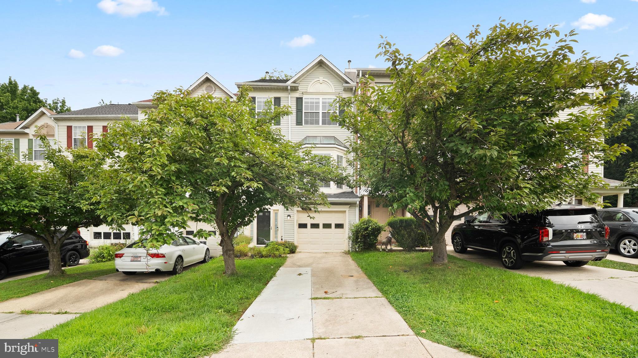 PROFESSIONAL PHOTOS COMING TODAY! Welcome home to this beautifully appointed townhome nestled in the desirable Pleasant Chase community close to major commuter routes, shopping, dining and entertainment. This 3BR home features 2-full bathrooms and 2 powder rooms, a one car garage, a screened in patio and deck perfect for outdoor living. Walk in to the bright foyer open to the floor above. The lower level rec room is spacious with a gas fireplace for cozy nights in. The main level boasts an open floor plan, a great kitchen with lots of storage, stainless steel appliances, an eat-in area, large pantry and deck access. Travel upstairs to the spacious primary bedroom with walk-in closet and en suite bath. Two additional graciously sized bedrooms and a full bath conclude the upper level sleeping quarters.