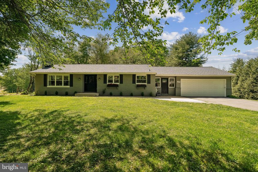 Beautifully renovated and well-loved rancher featuring 4 bedrooms and 3 full bathrooms, offers substantial upgrades throughout. The updated kitchen and baths, along with hardwood, ceramic, and LVP flooring, create a fresh and modern feel. Set on an exceptional 1 acre private lot backing to mature trees and farmland, this home combines peaceful surroundings with a convenient location and easy access to major commuter routes. Completely renovated in 2018, major updates include the kitchen, plumbing (now on public water), electrical, windows, and doors—providing peace of mind for years to come. The expansive lower level offers a spacious recreation space, 4th bedroom, full bath, storage room, and laundry—perfect for guests or flexible living. A NEWLY INSTALLED ROOF (2026) adds even more value. Enjoy year-round comfort in the all-seasons family room with heat and AC. The cozy front living room features front light-filled windows, and a fireplace ideal for relaxing evenings. Additional highlights include a 2 car garage, oversized driveway with ample parking, and a gorgeous patio with amazing built-in firepit—perfect for entertaining or enjoying the serene setting.